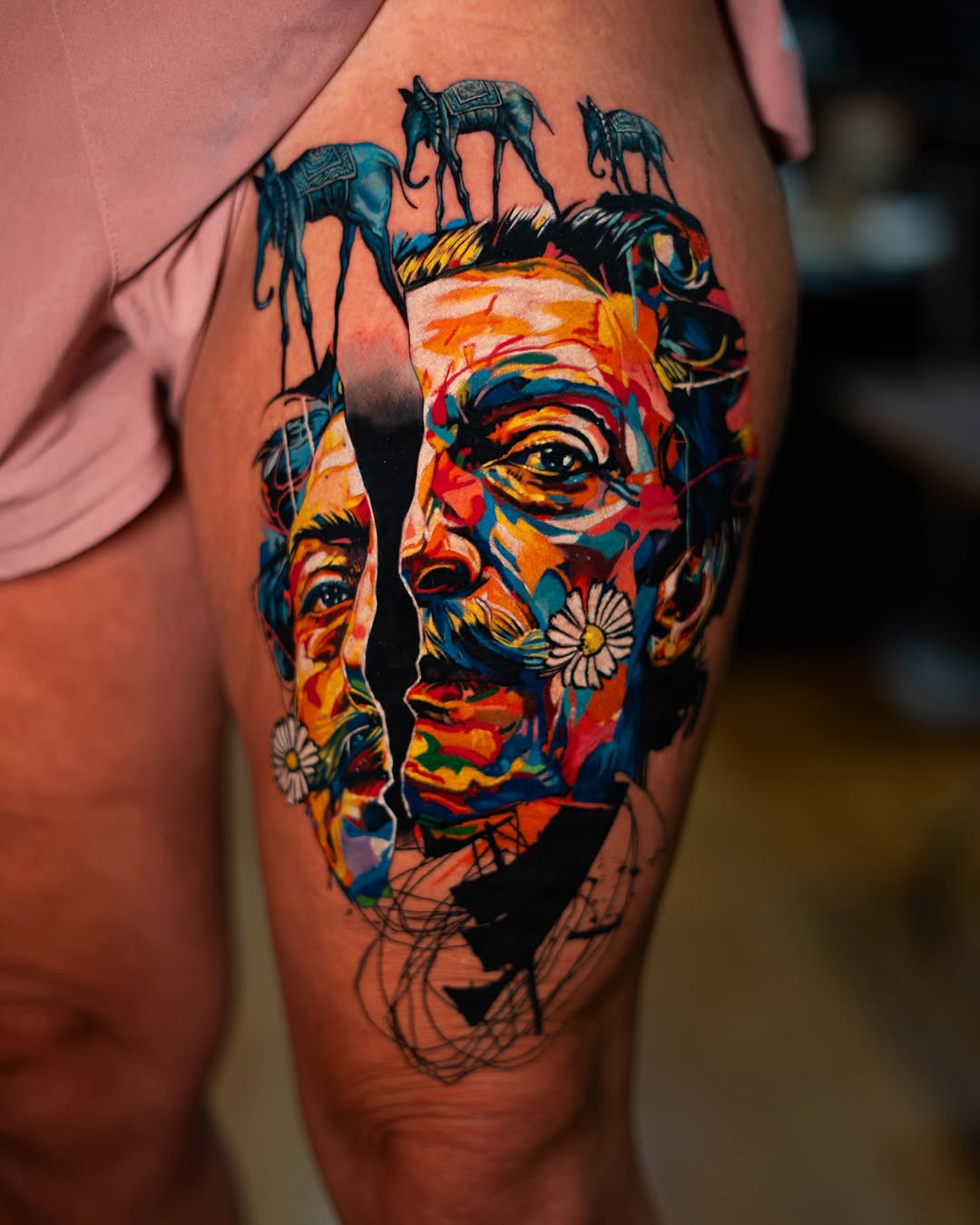 Salvador Dali portrait with elephants surrealism tattoo on the thigh by Israel De Jesus Legonier Aguliera