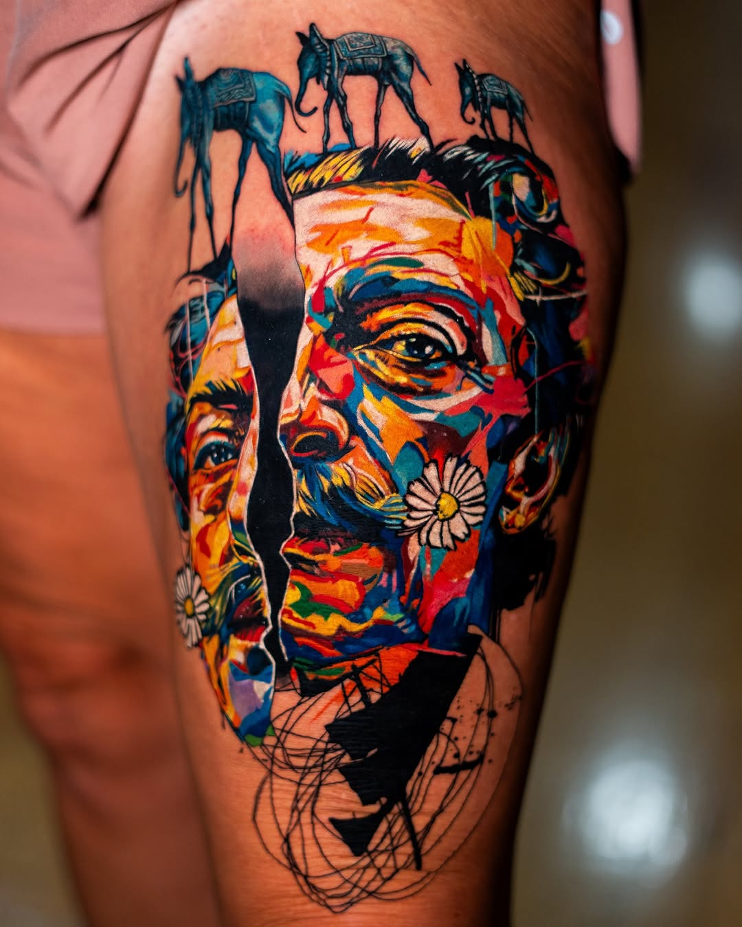 Salvador Dali portrait with elephants surrealism tattoo on the thigh by Israel De Jesus Legonier Aguliera