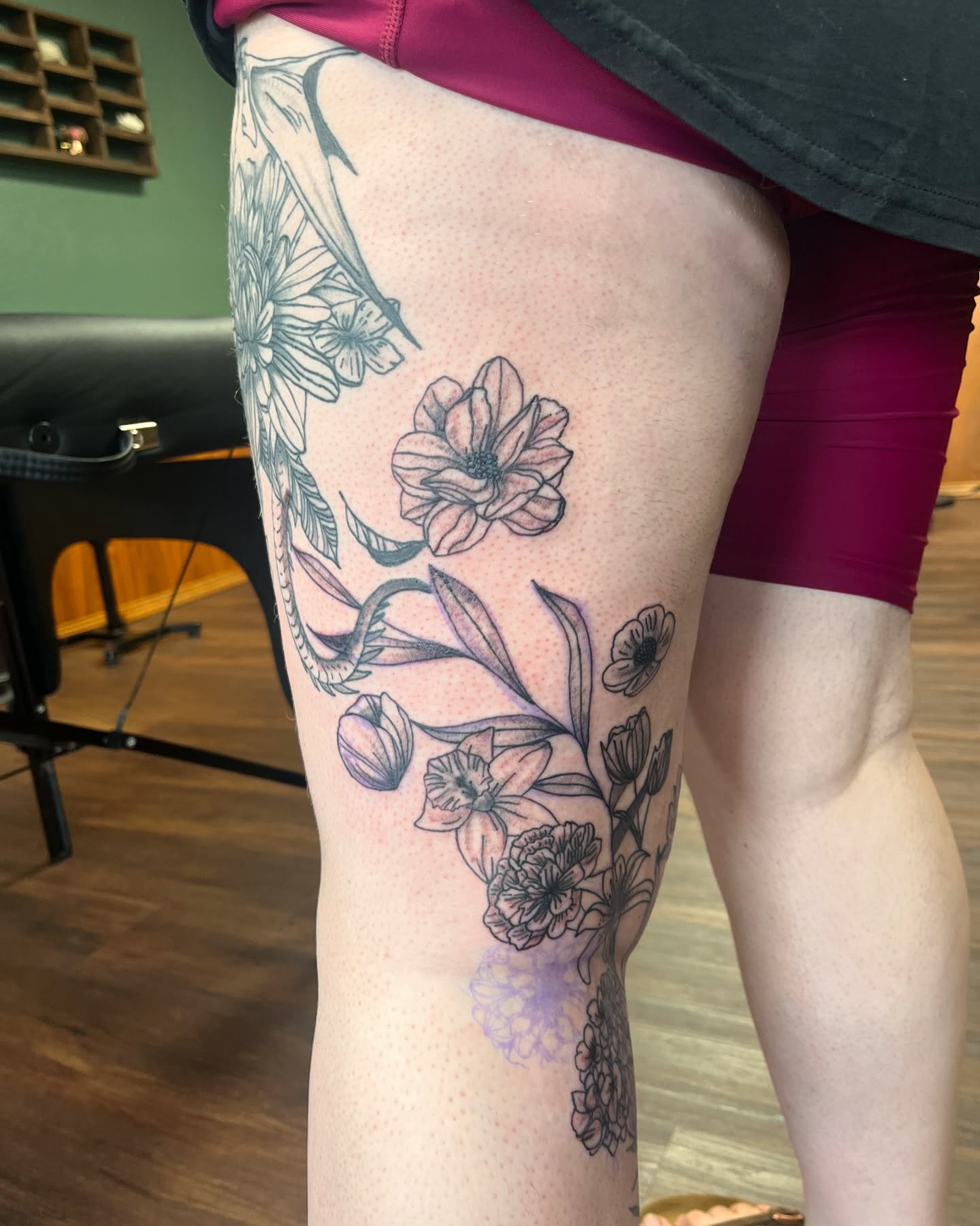 Floral arrangement dotwork tattoo on the thigh by Michelle