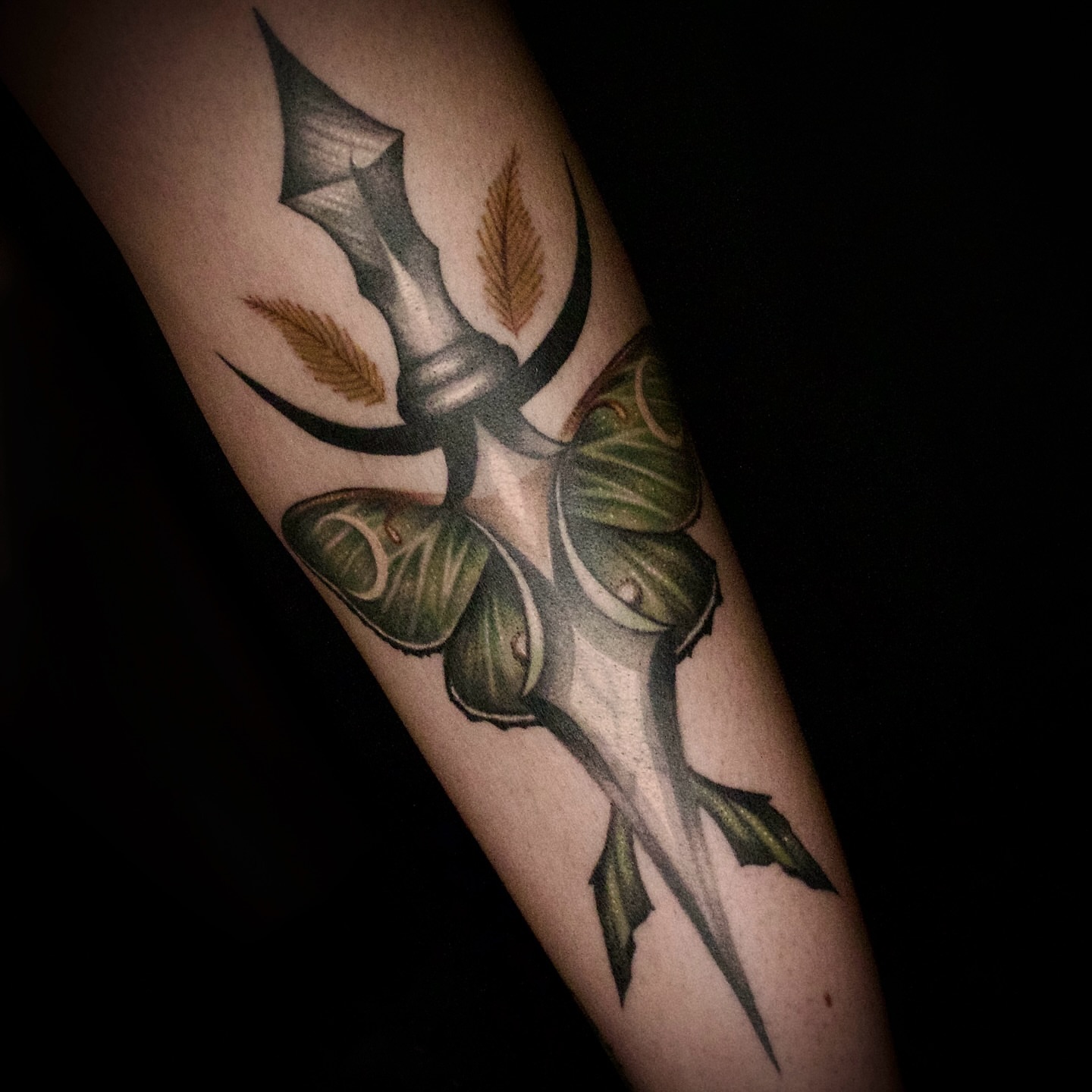 Dagger with leaves American traditional tattoo on the forearm by Galen