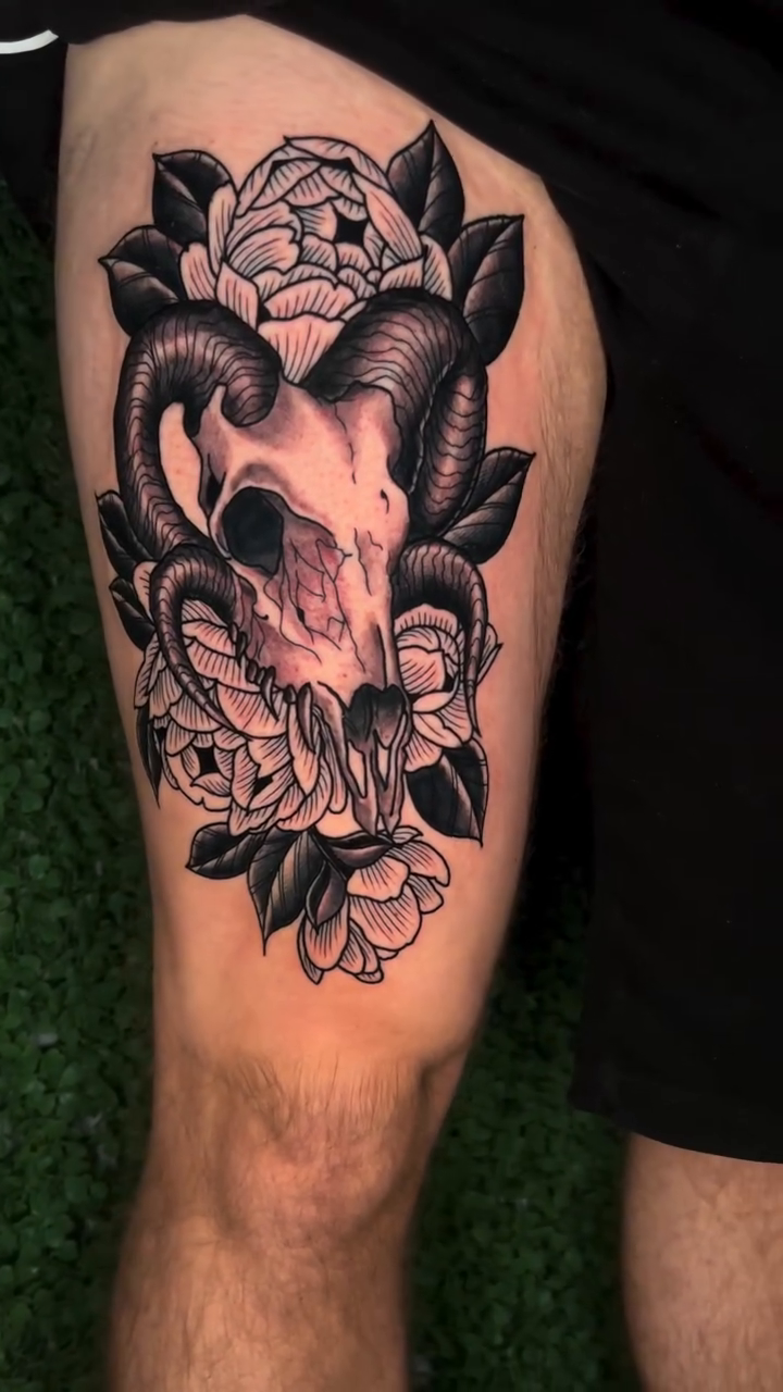 Ram skull with flowers dark realism tattoo by H.G