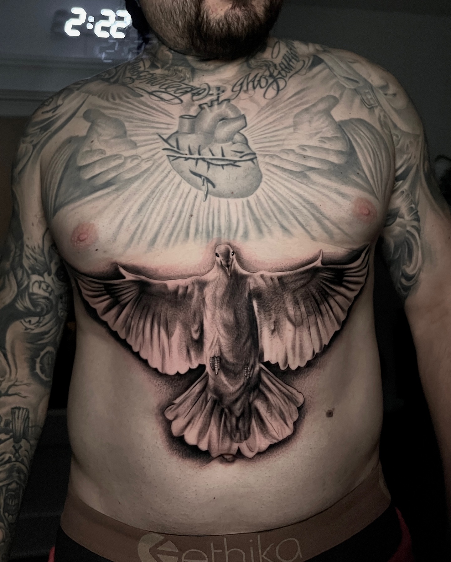 Heart and dove realism tattoo on the chest by Jesse Temores