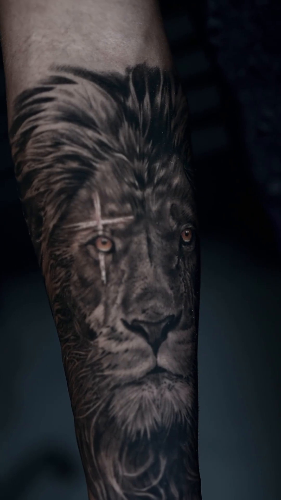 Lion with cross realism tattoo by Yohandri Sosa