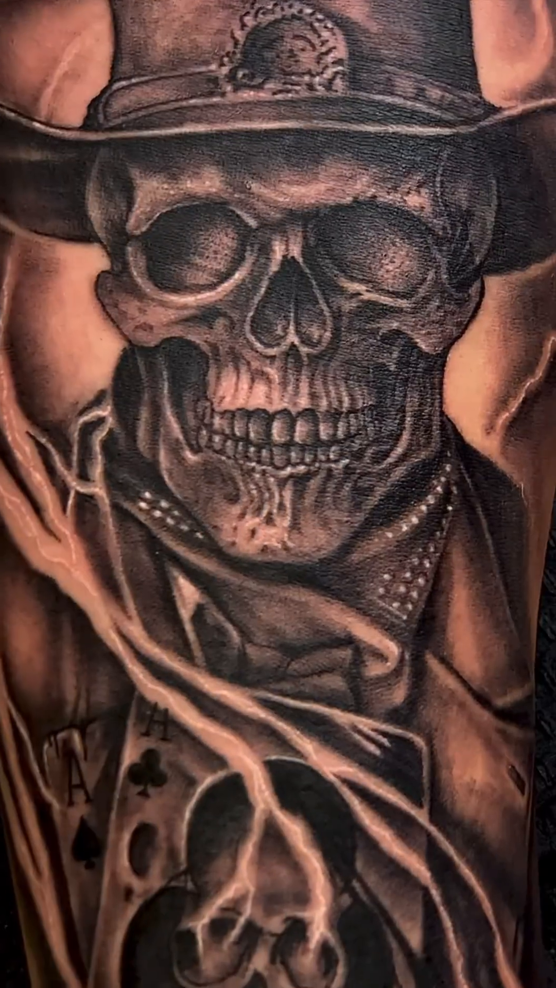 Skull with hat and playing cards realism tattoo by Justin James
