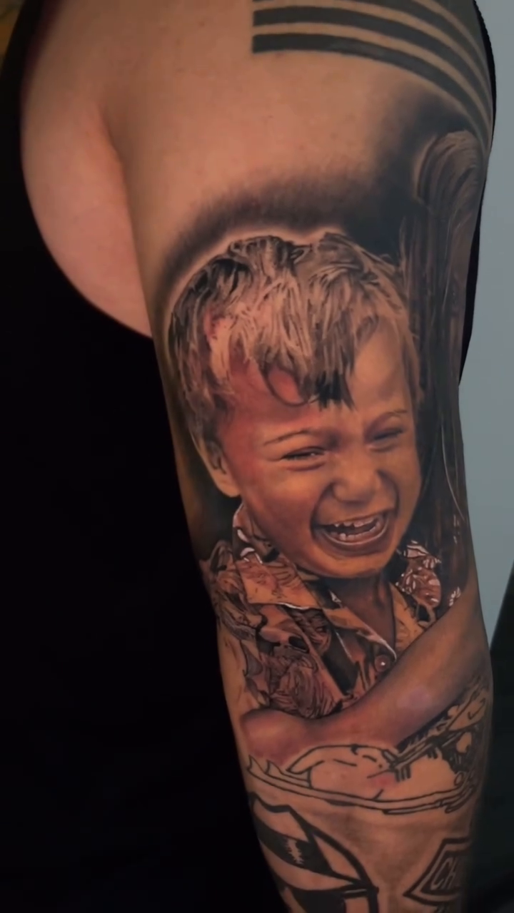 Two children realism tattoo by Richie Moreno lll