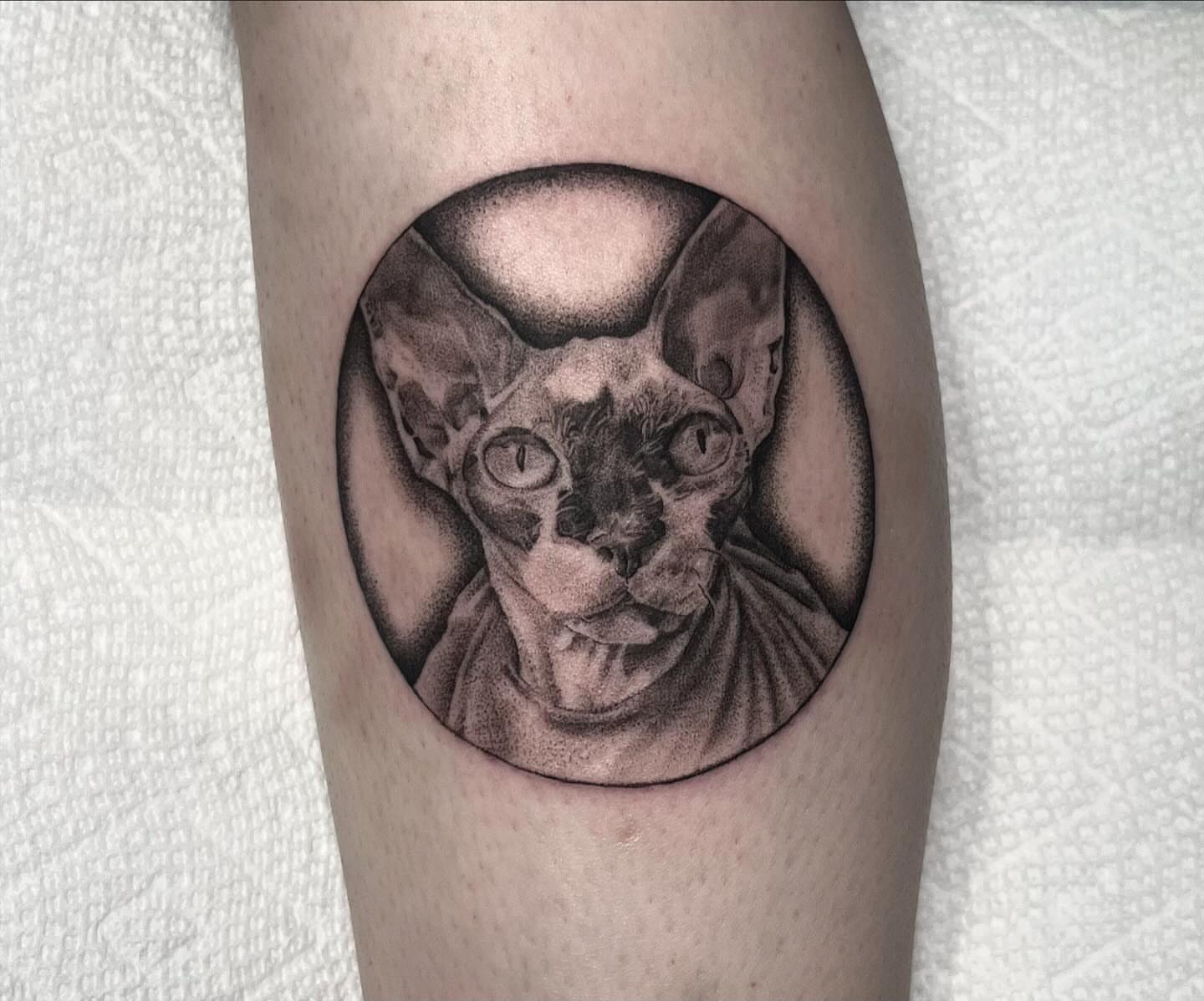 Cat dotwork tattoo on the thigh by Lee Ranco