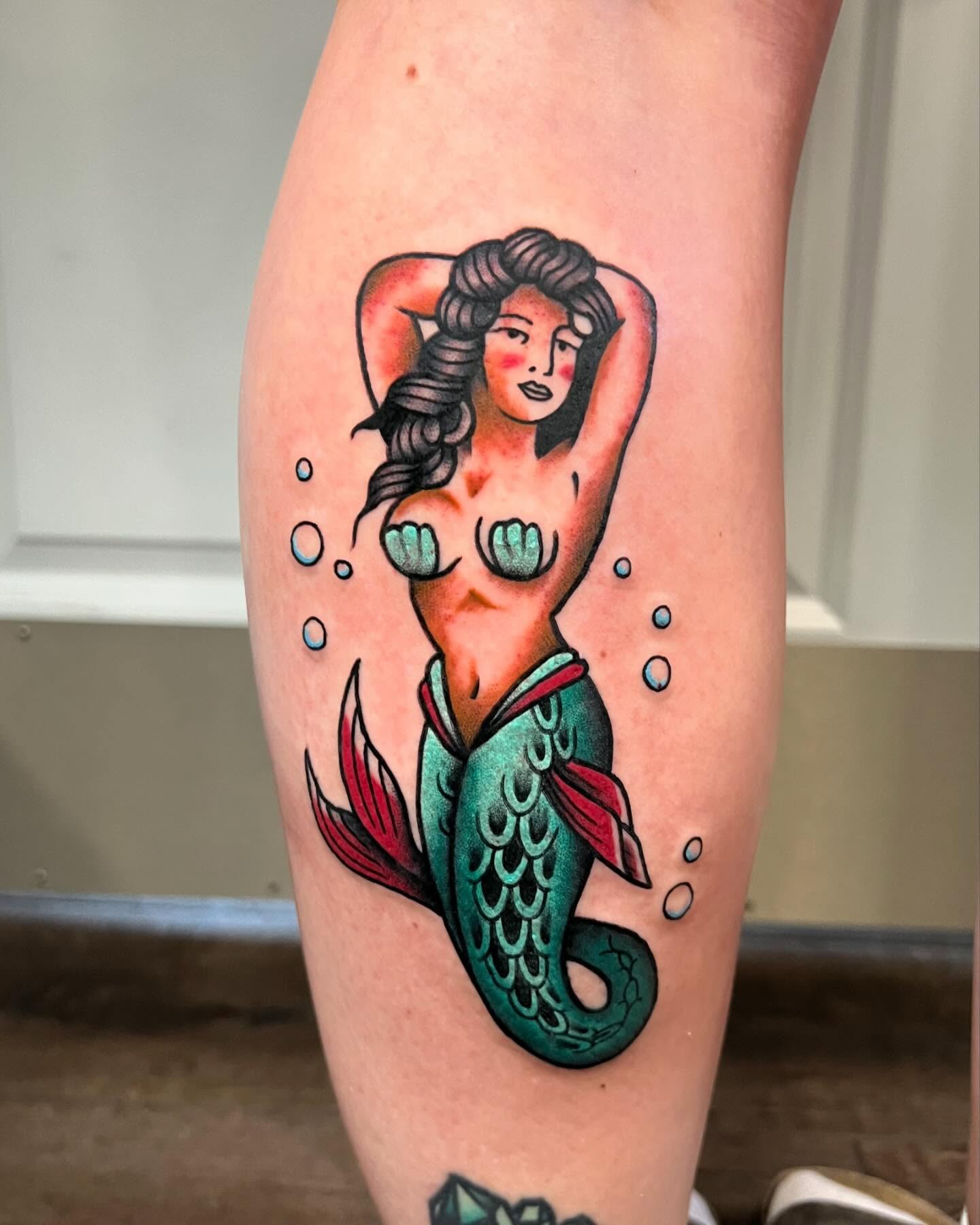 Mermaid American traditional tattoo on the thigh by Nick Monastra