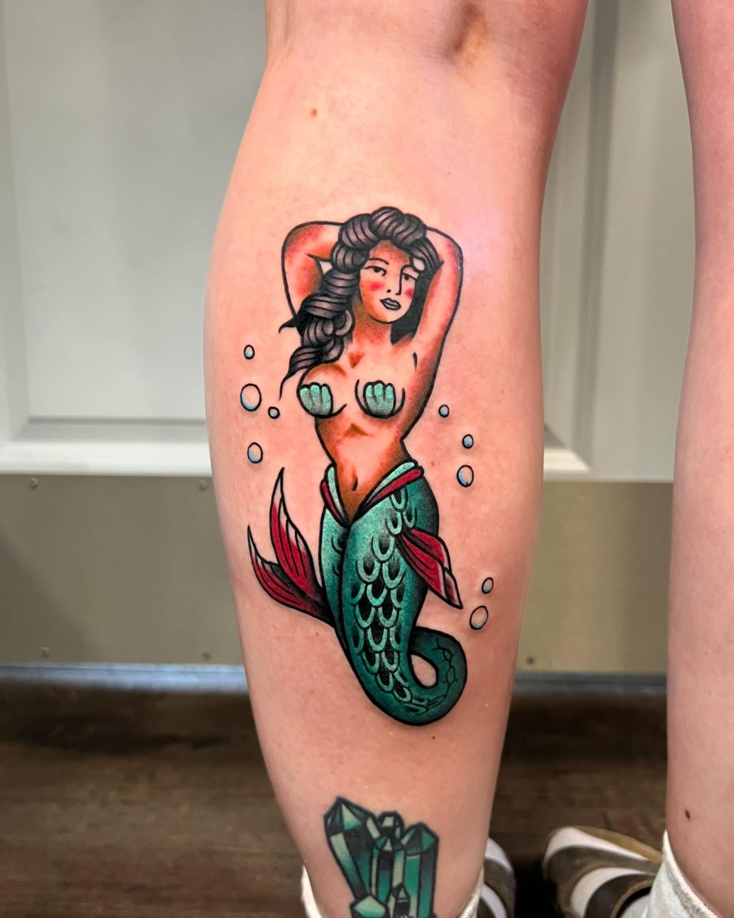 Mermaid American traditional tattoo on the thigh by Nick Monastra