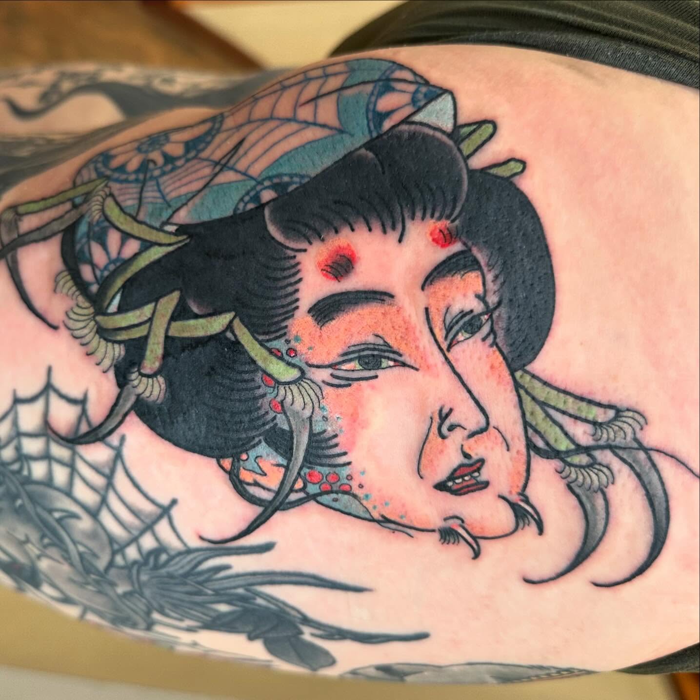 Geisha head American traditional tattoo on the shoulder by Blake Brand