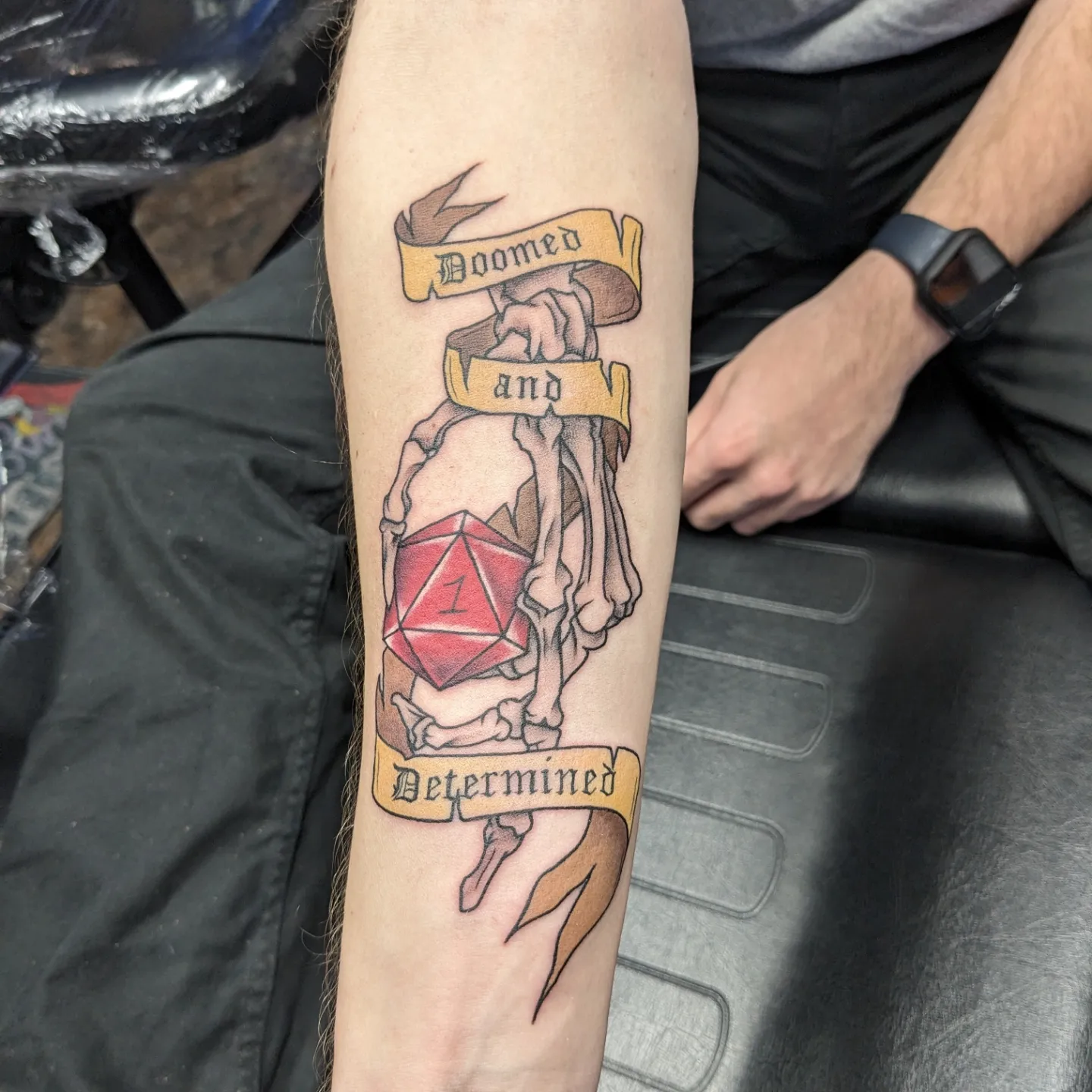 Determined realism tattoo on the forearm by Kara Falcon