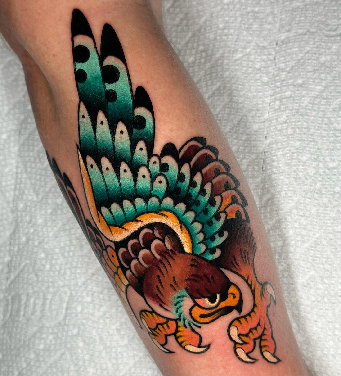 Peacock American traditional tattoo on the forearm by π»πππππ πΉπππ