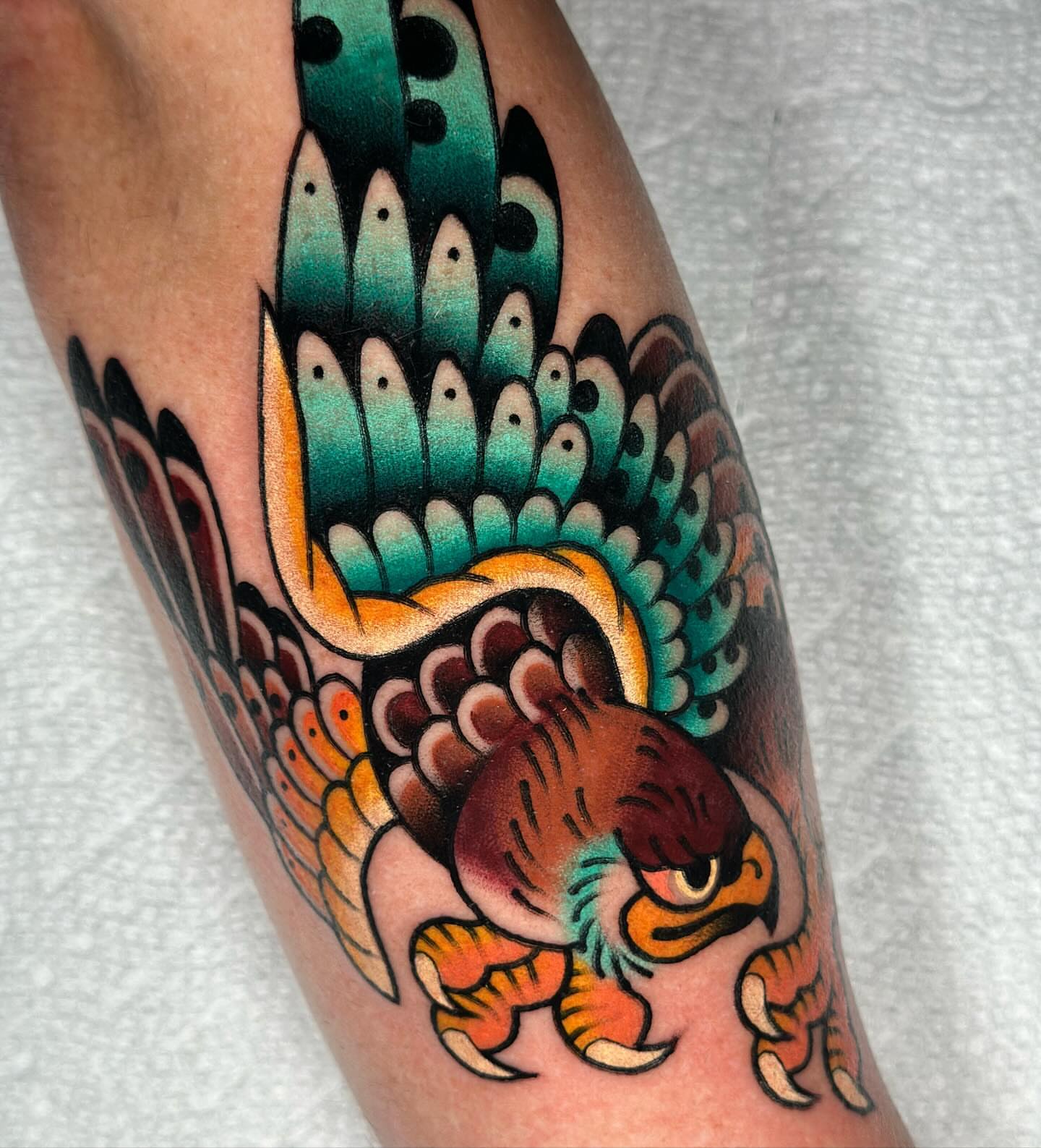Peacock American traditional tattoo on the forearm by π»πππππ πΉπππ