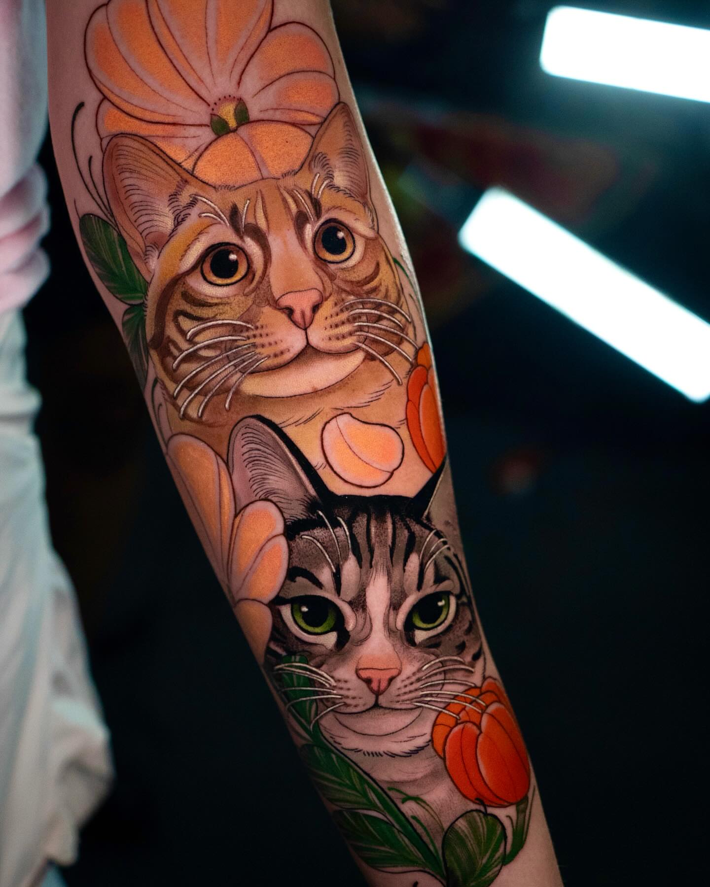 Cats and flowers realism tattoo on the forearm by Andres Acevedo, Denver, Colorado