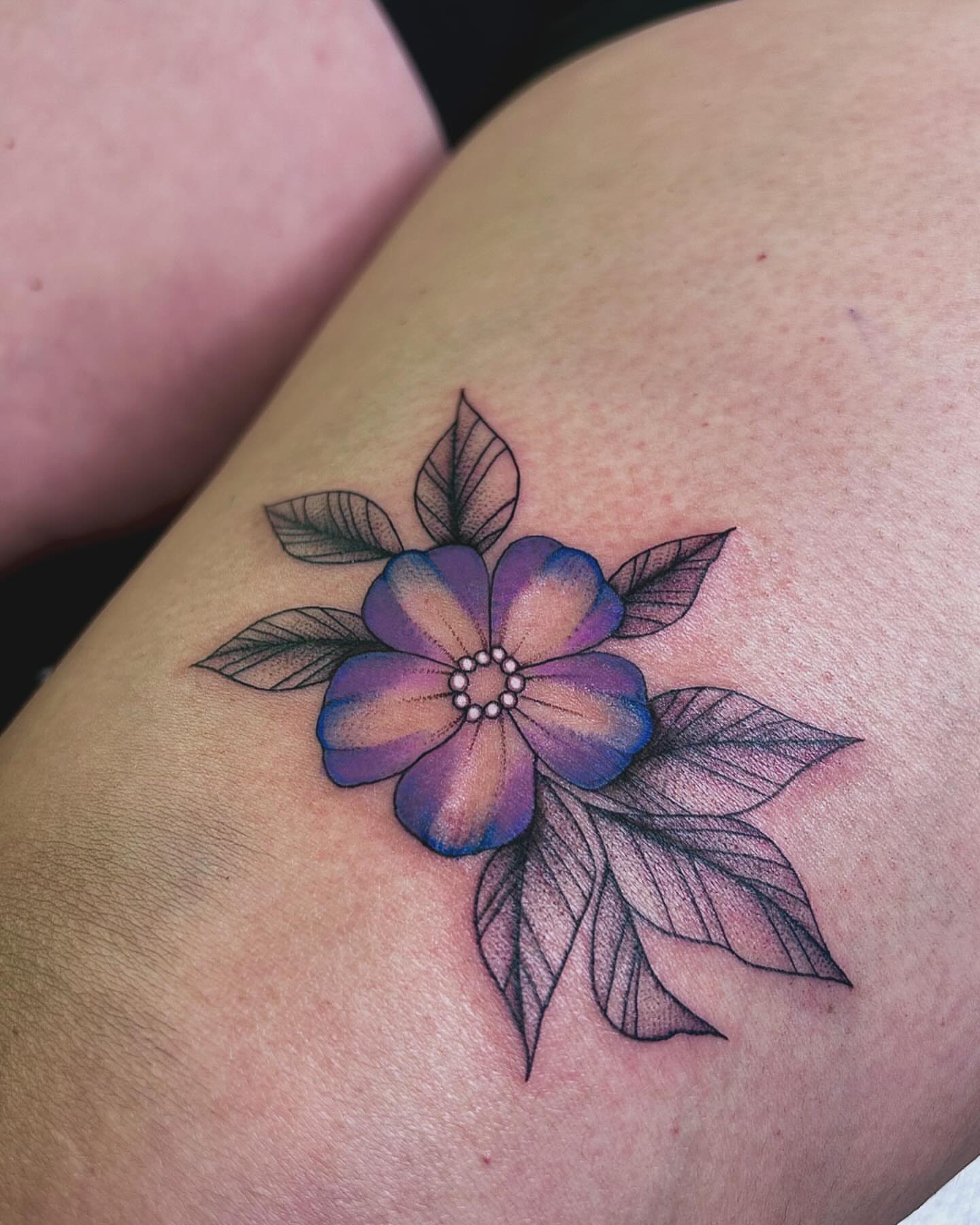 Purple flower dotwork tattoo on the thigh by Tattoo Artist