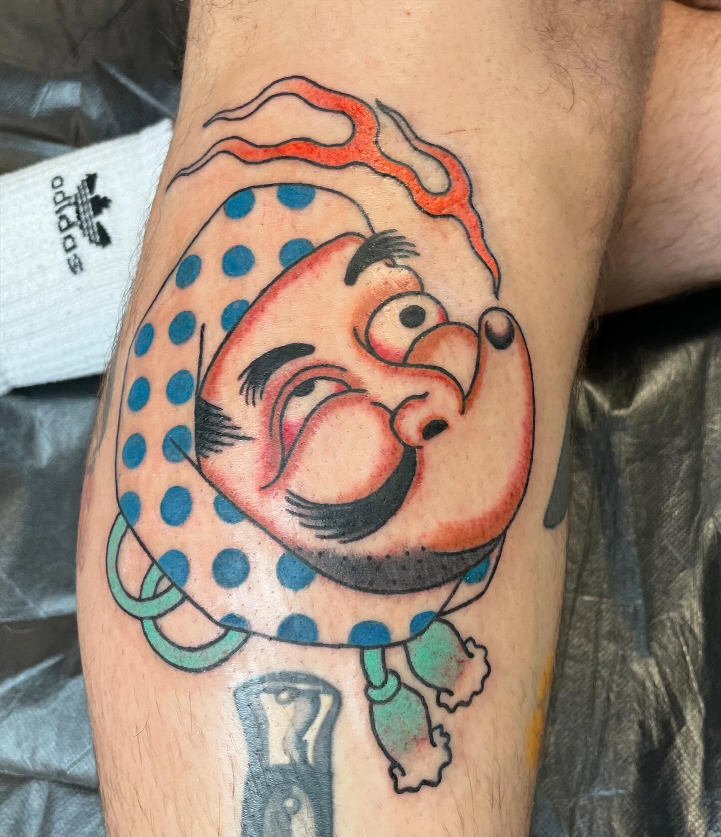 Clown head American traditional tattoo on the forearm by Seth Griffin