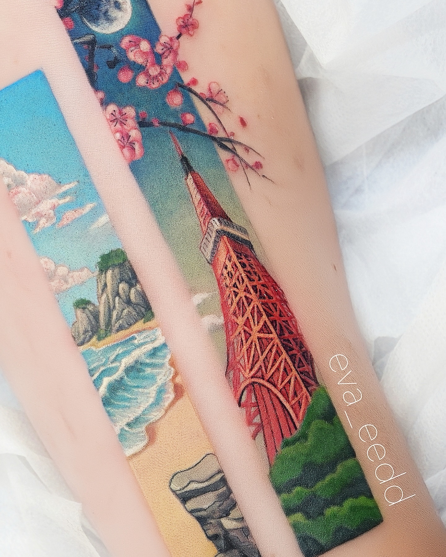 Tower and cherry blossoms geometric tattoo on the forearm by Eva Liu
