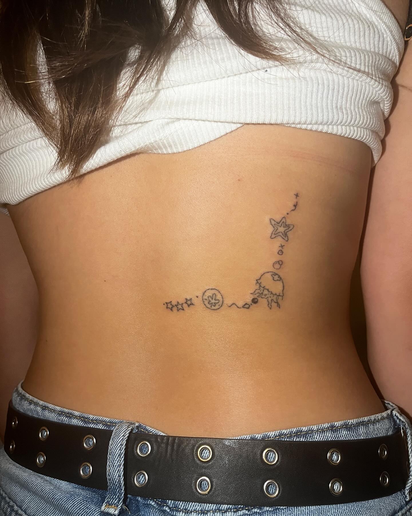 Space-themed dotwork tattoo on the back by hana