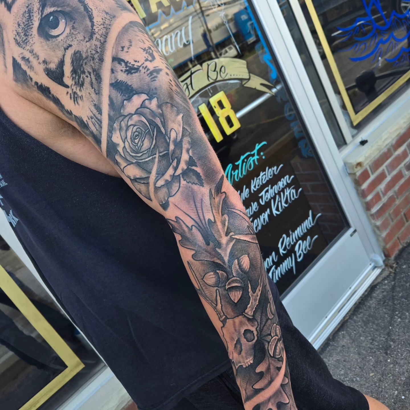 Lion, rose, skull realism tattoo on the forearm by David Johnson