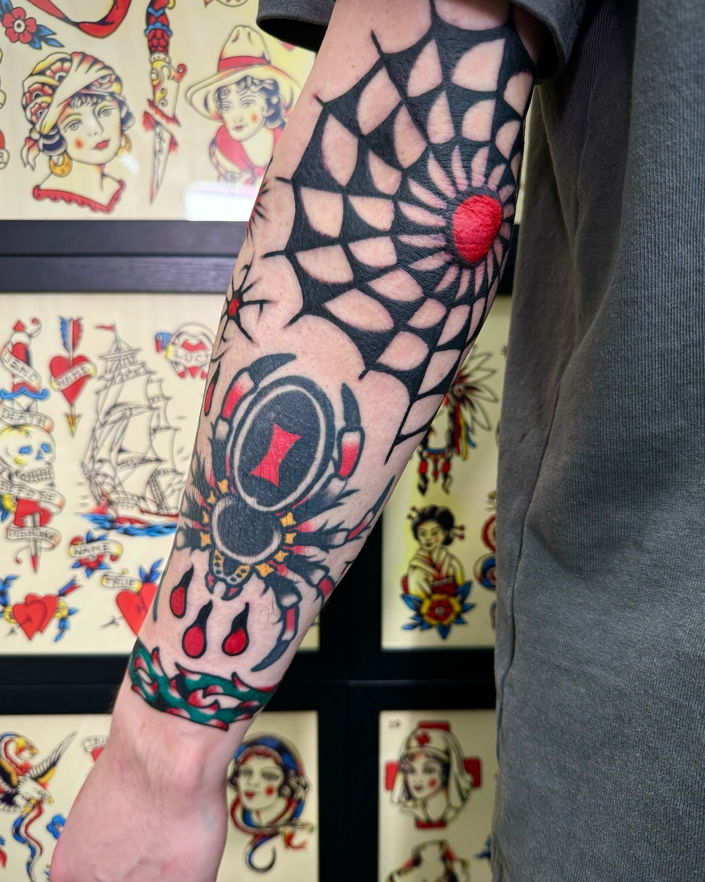 Geometric spiderweb American traditional tattoo on the forearm by Nicholas Mella, Nashville, Tennessee