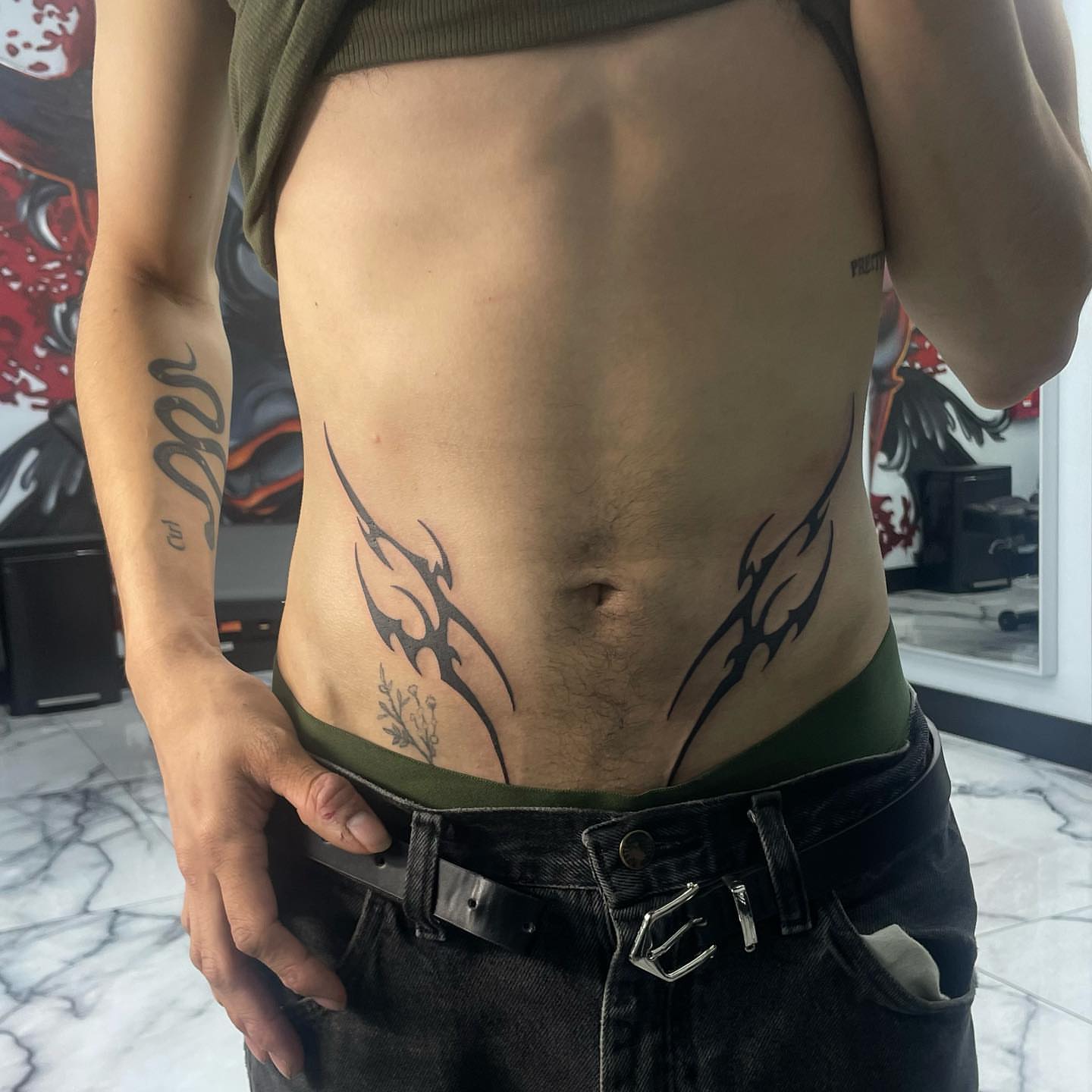 Tribal design tribal tattoo on the torso by Austin Jones