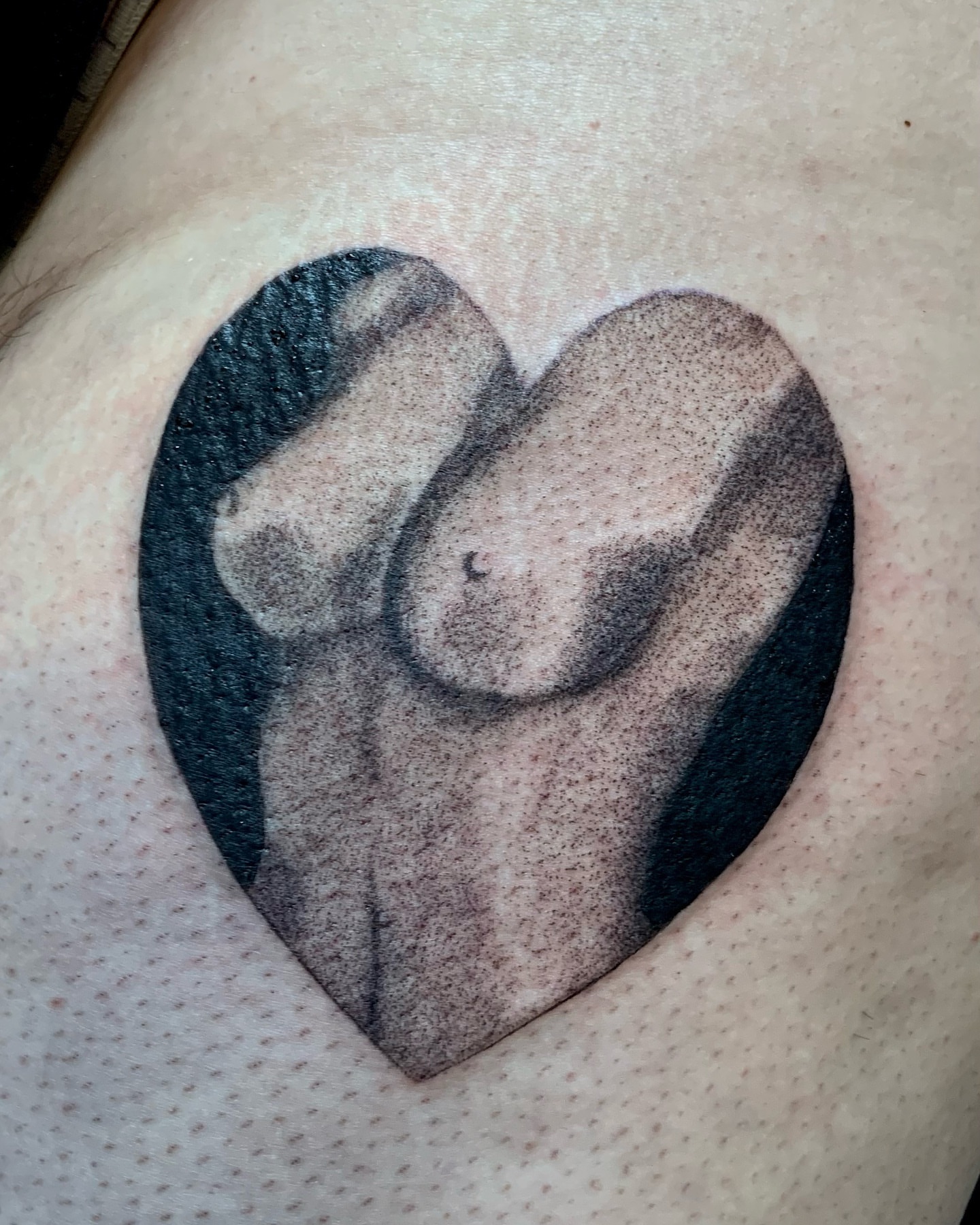 Heart dotwork tattoo on the chest by Maddy Paige