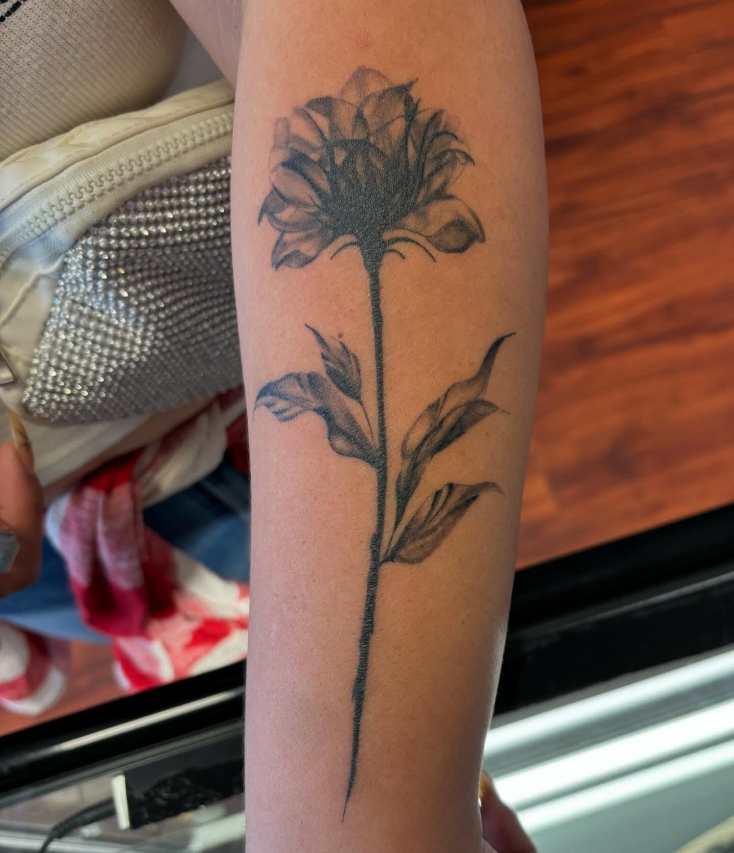 Flower black and grey tattoo on the forearm by Amy Kolton