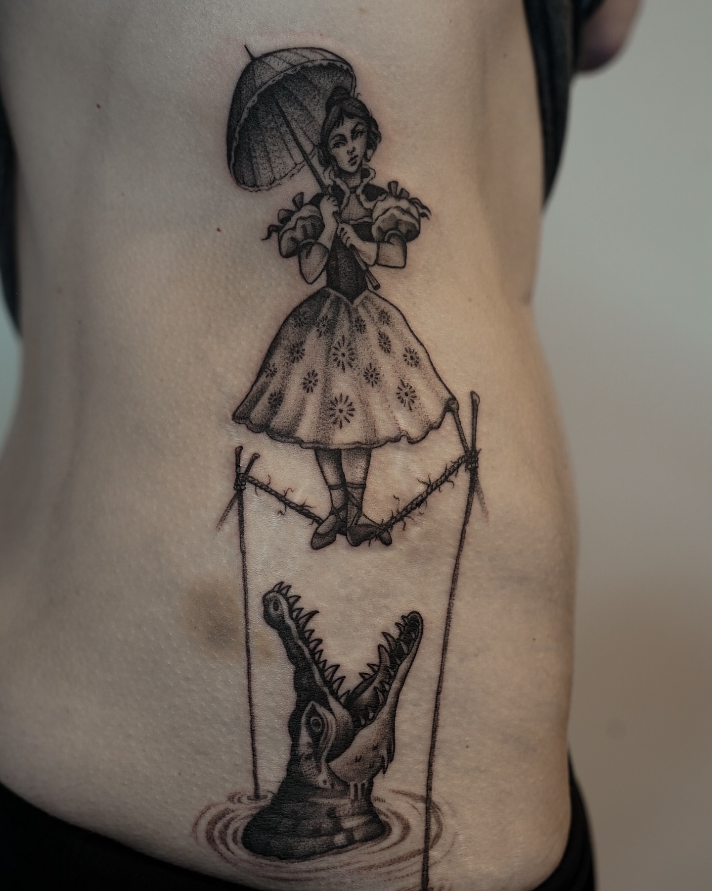 Mary poppins black and grey tattoo on the ribs by Bruna Bianculli