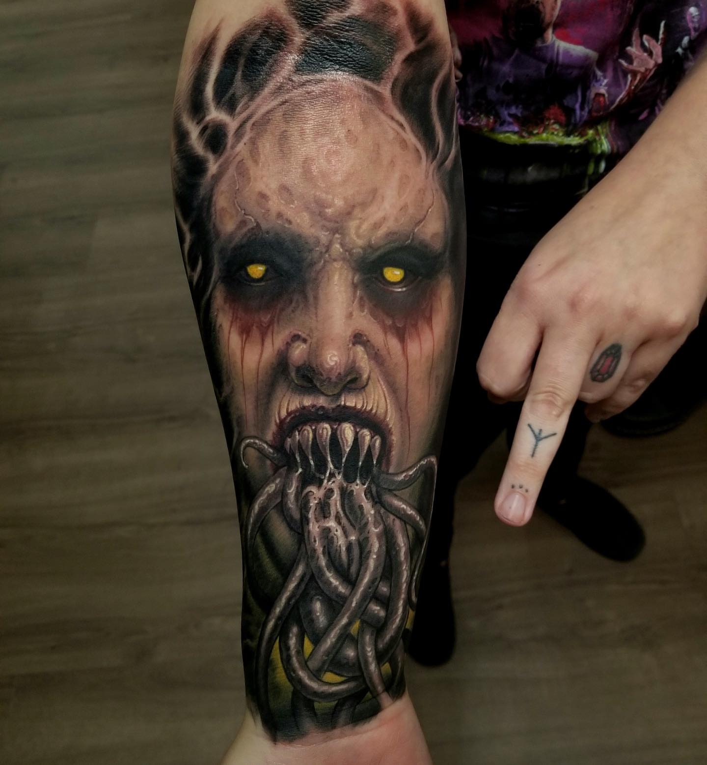 Zombie realism tattoo on the forearm by Rick Rayne
