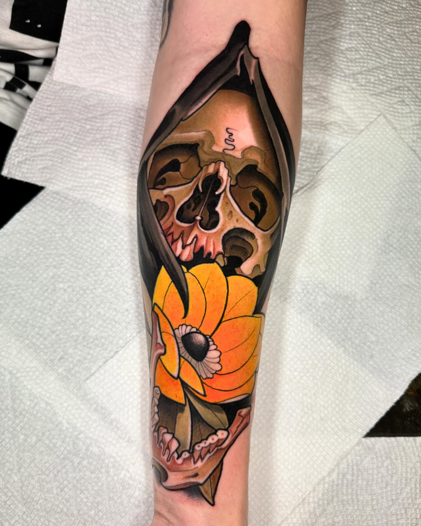 Skull and flower American traditional tattoo on the forearm by Matt - Neotrad Tattoos, New York, New York