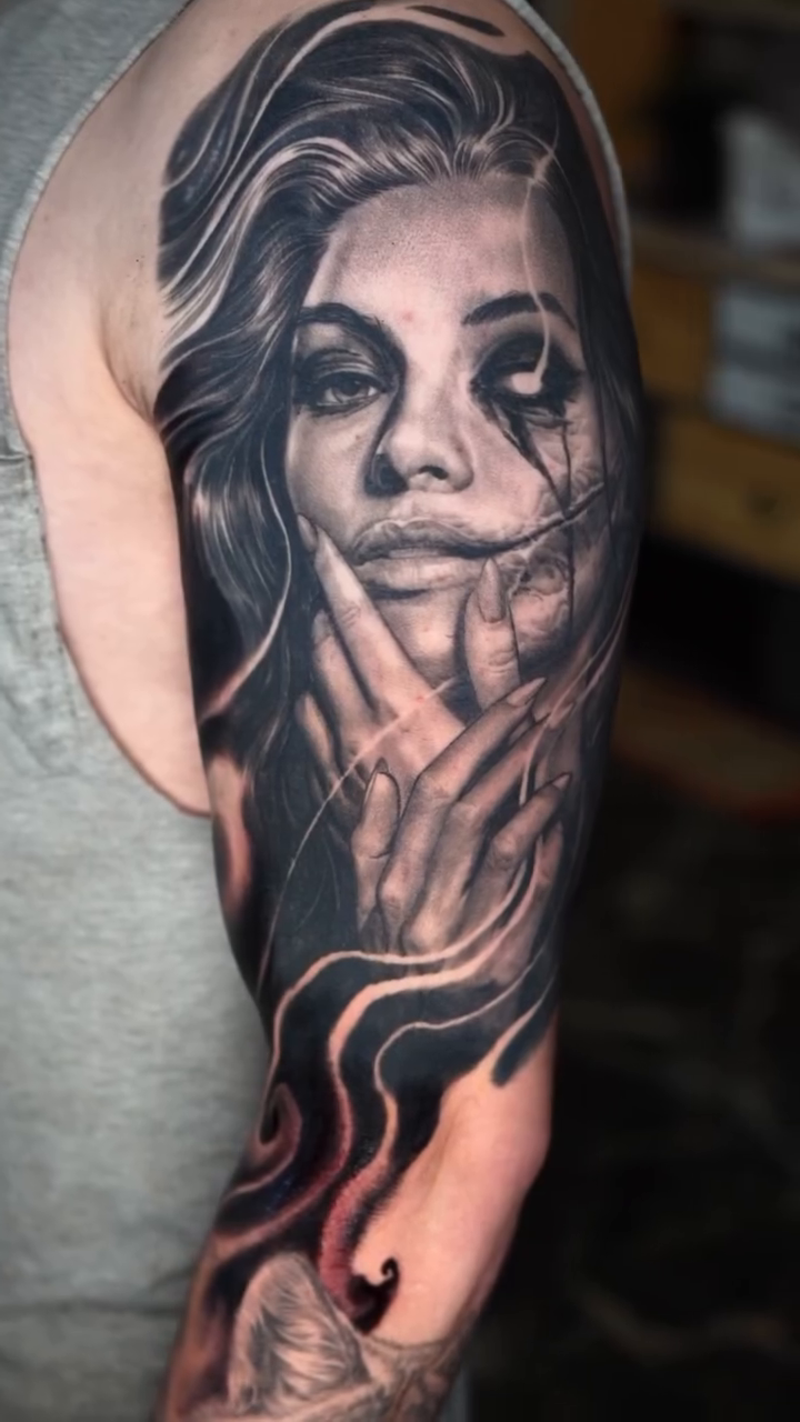 Woman with stitched mouth realism tattoo by Jake Ross, Mentor, Ohio