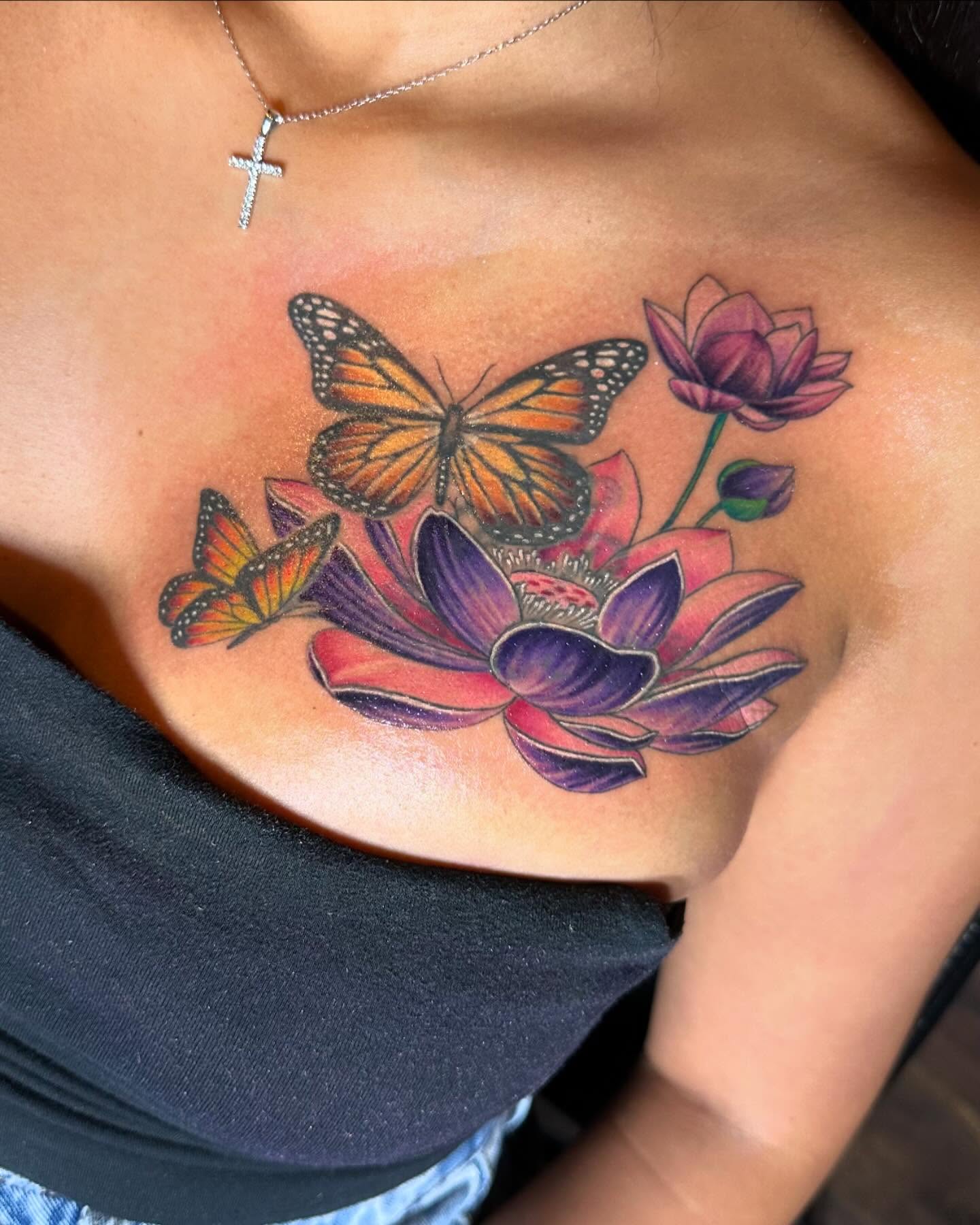 Butterfly and lotus realism tattoo on the chest by Jevon Glasco Tattoos