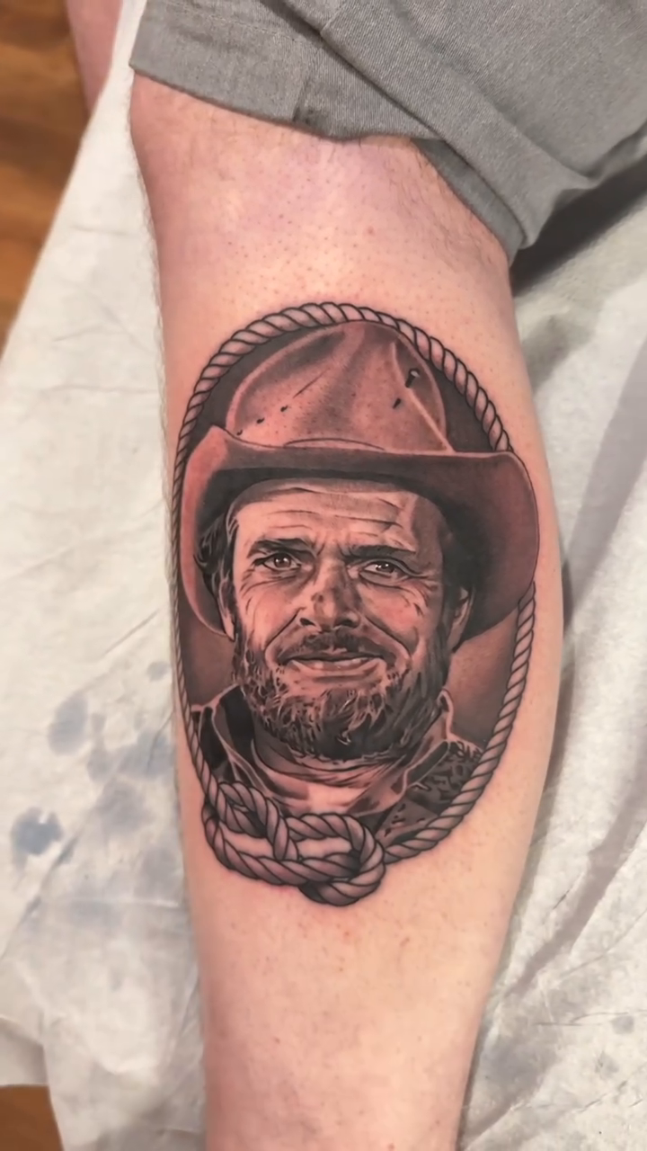 Man and cowboy hat realism tattoo by Bradley Dozier