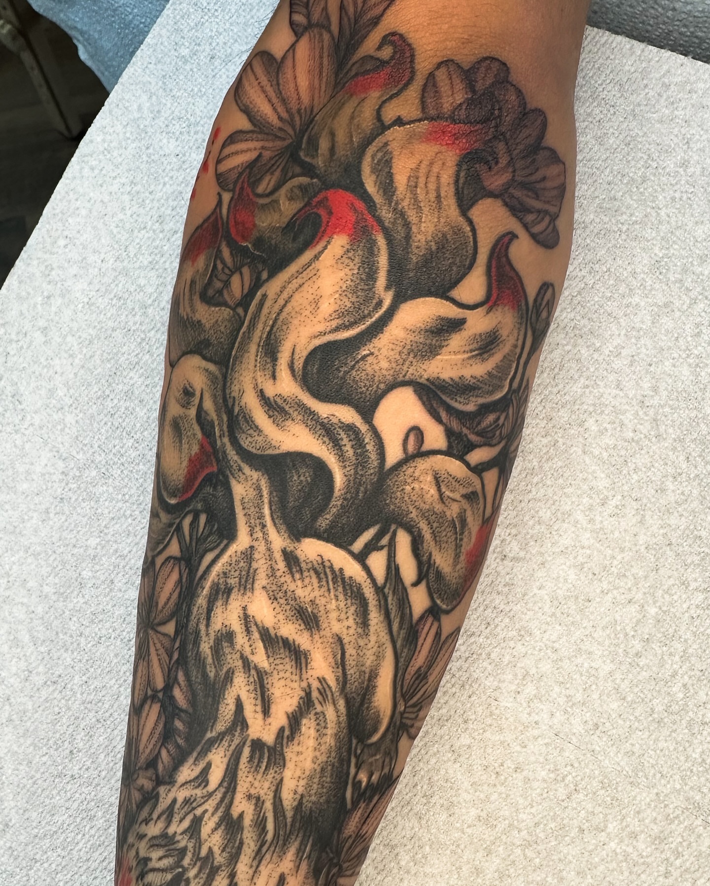 Abstract figure dotwork tattoo on the forearm by Tony Murray