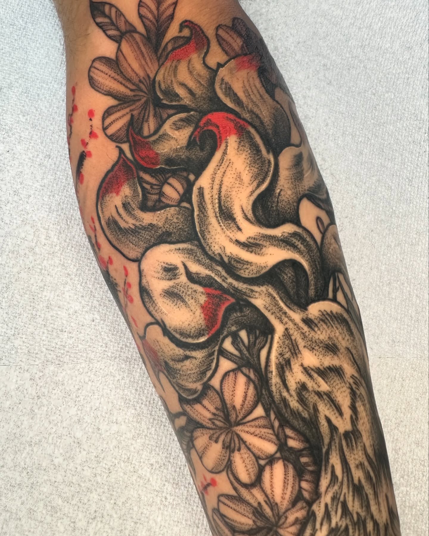 Floral arrangement dotwork tattoo on the forearm by Tony Murray