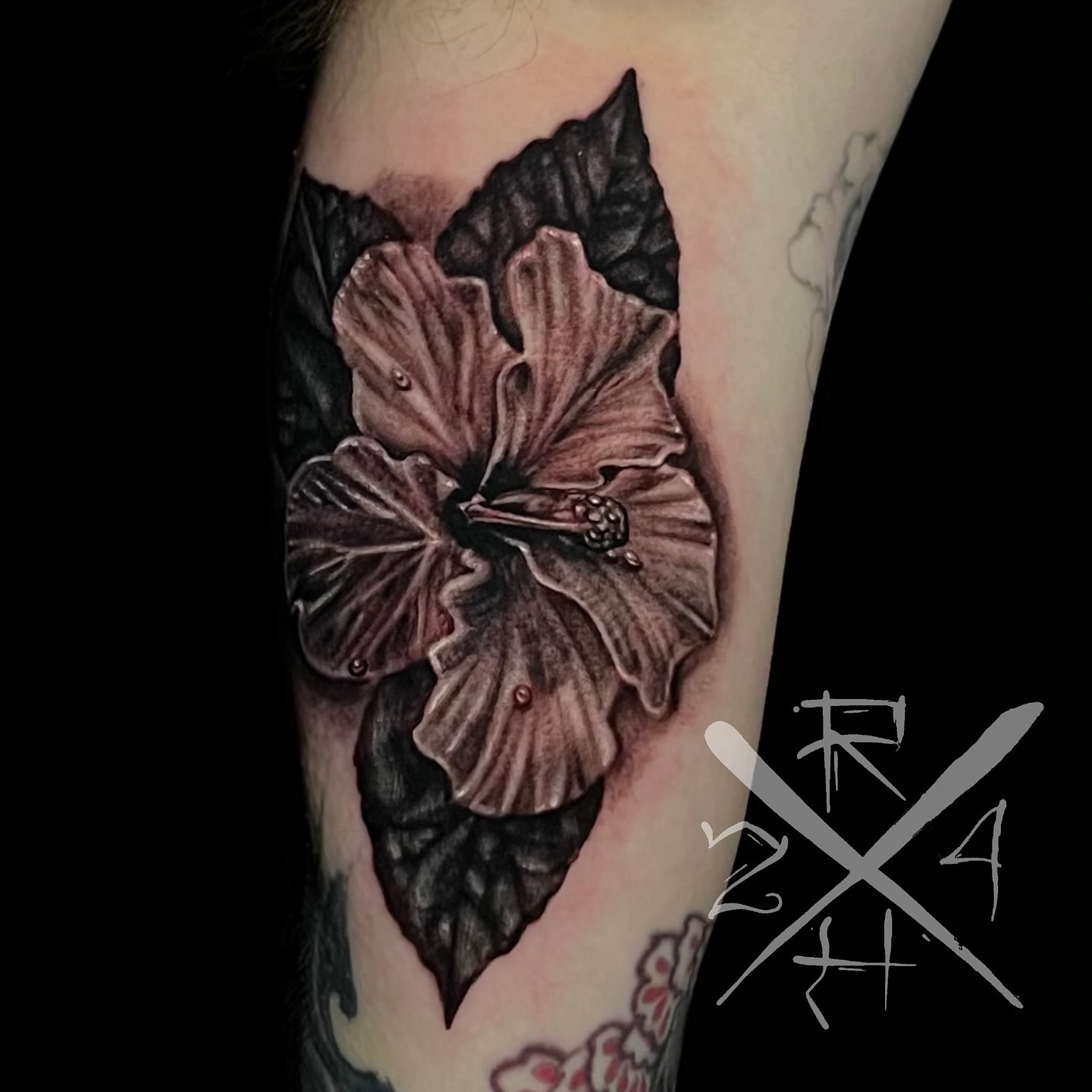 Hibiscus flower realism tattoo on the forearm by Ryan