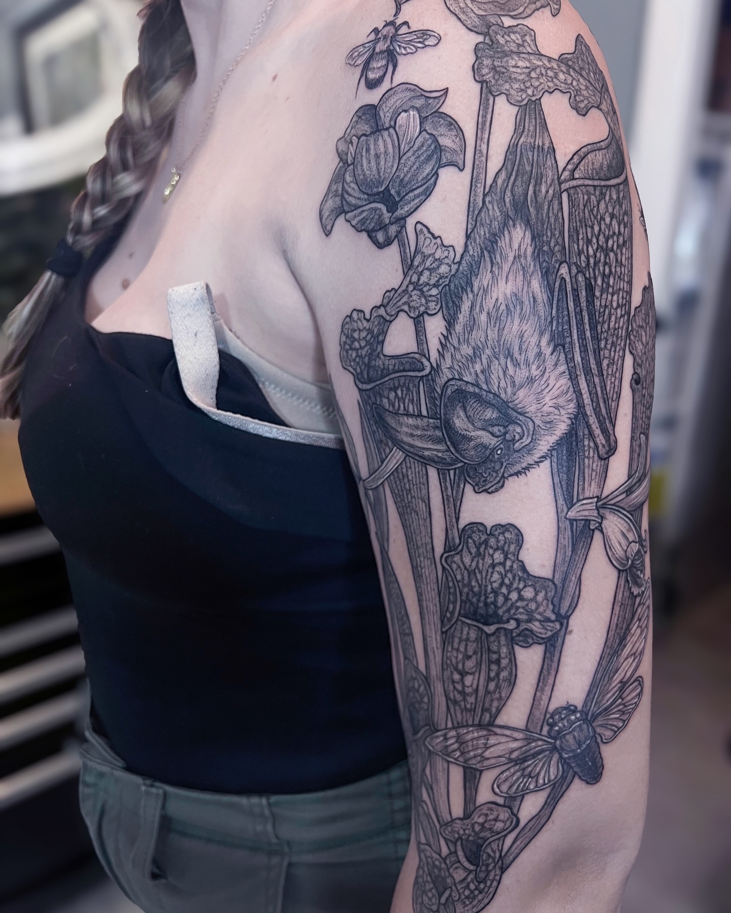 Bat and pitcher plant realism tattoo on the upper arm by 𝗝𝗲𝘀𝘀𝗶𝗲 𝗩𝗶𝗼𝗹𝗲𝘁