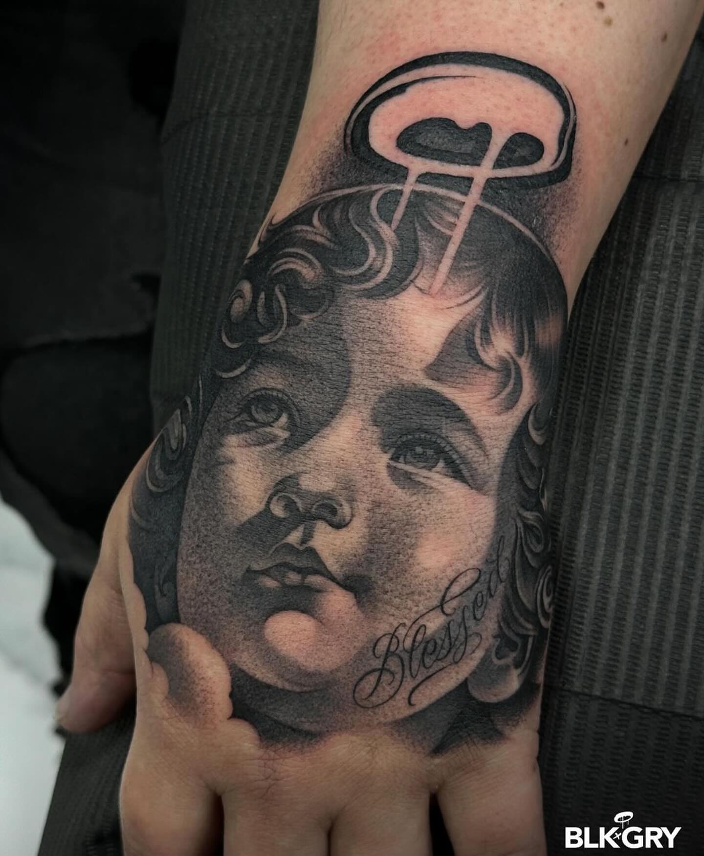 Tattoo by @angelstat2 — black_and_grey, realism