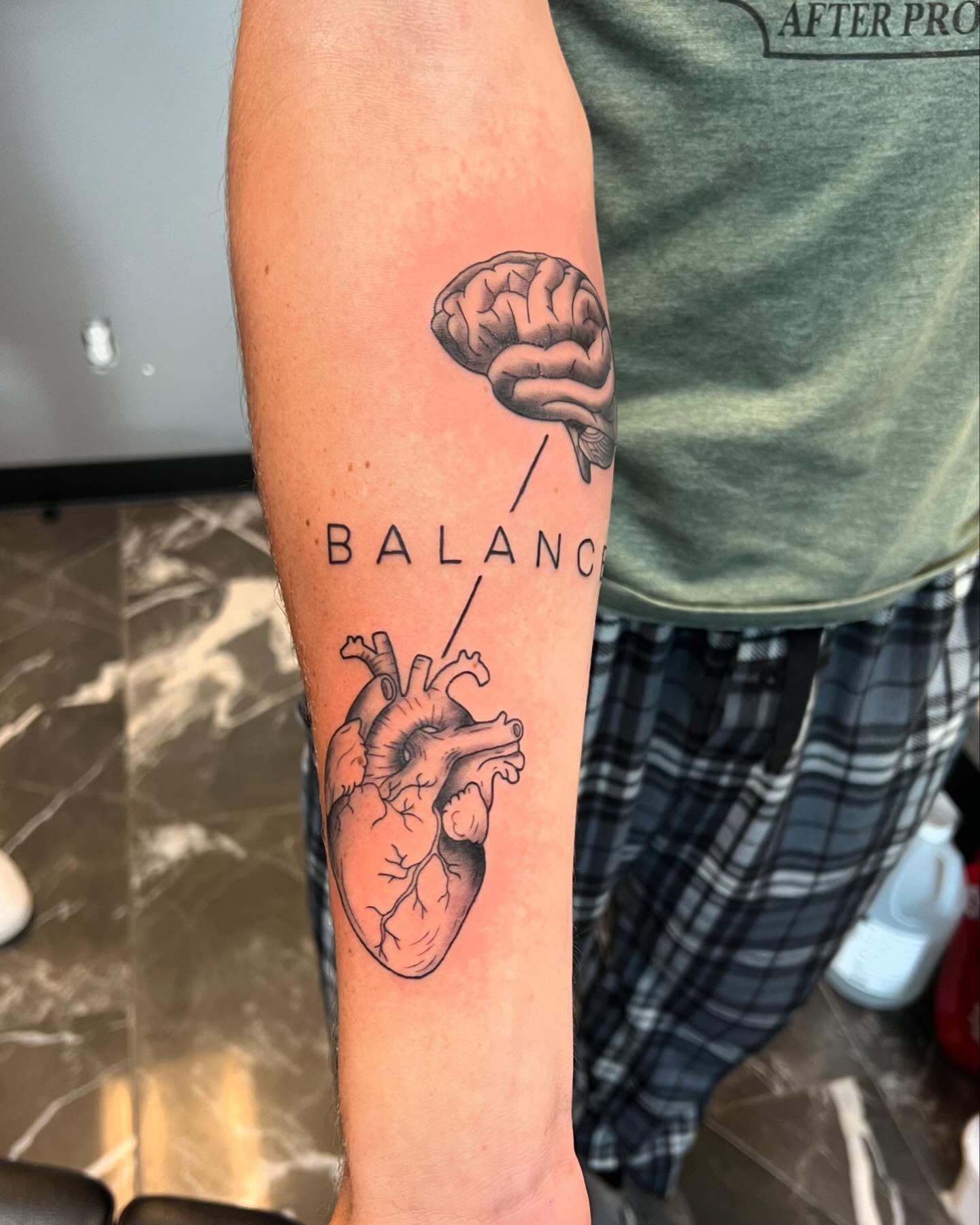 Heart and brain realism tattoo on the forearm by Brooke, Kansas City, Missouri
