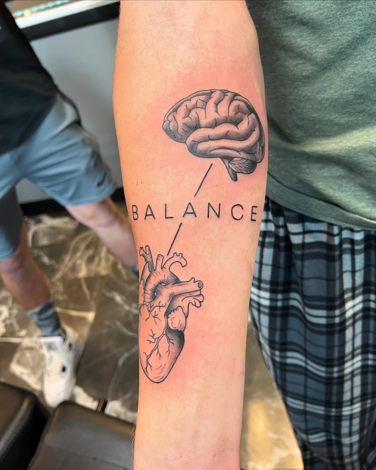 Brain and heart realism tattoo on the forearm by Brooke, Kansas City, Missouri