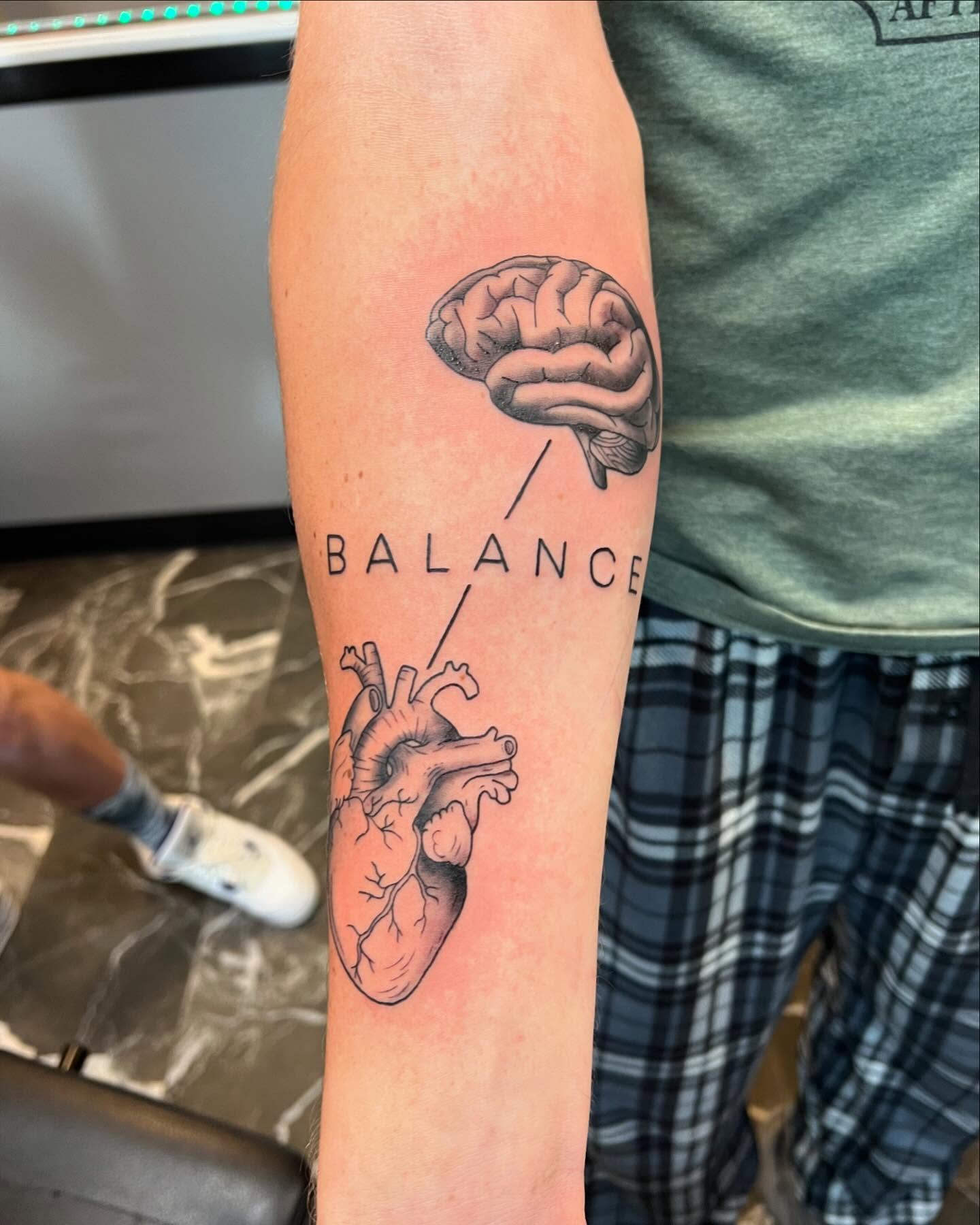 Brain and heart realism tattoo on the forearm by Brooke, Kansas City, Missouri