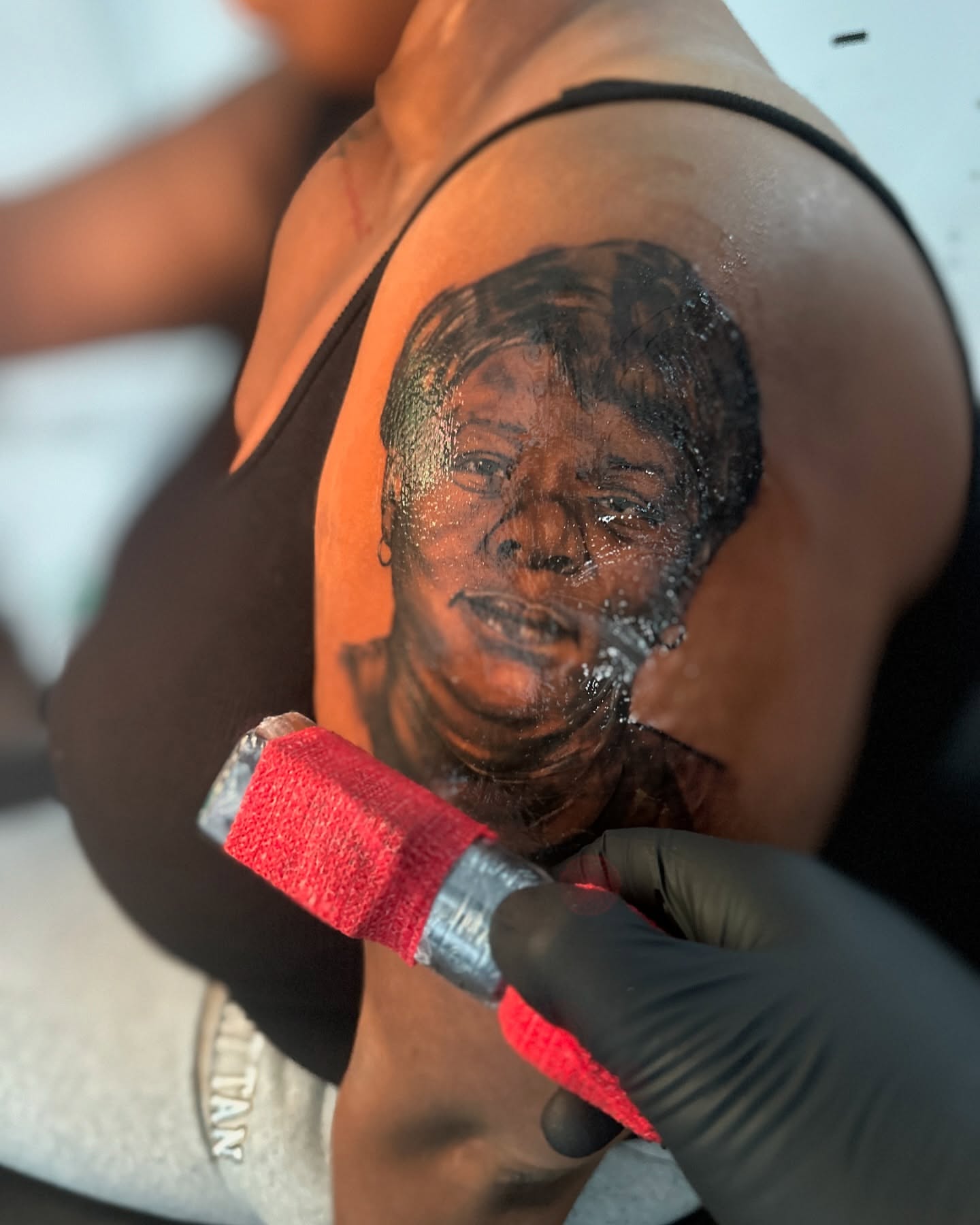 Portrait realism tattoo on the shoulder by ᴡᴏʀᴍ
