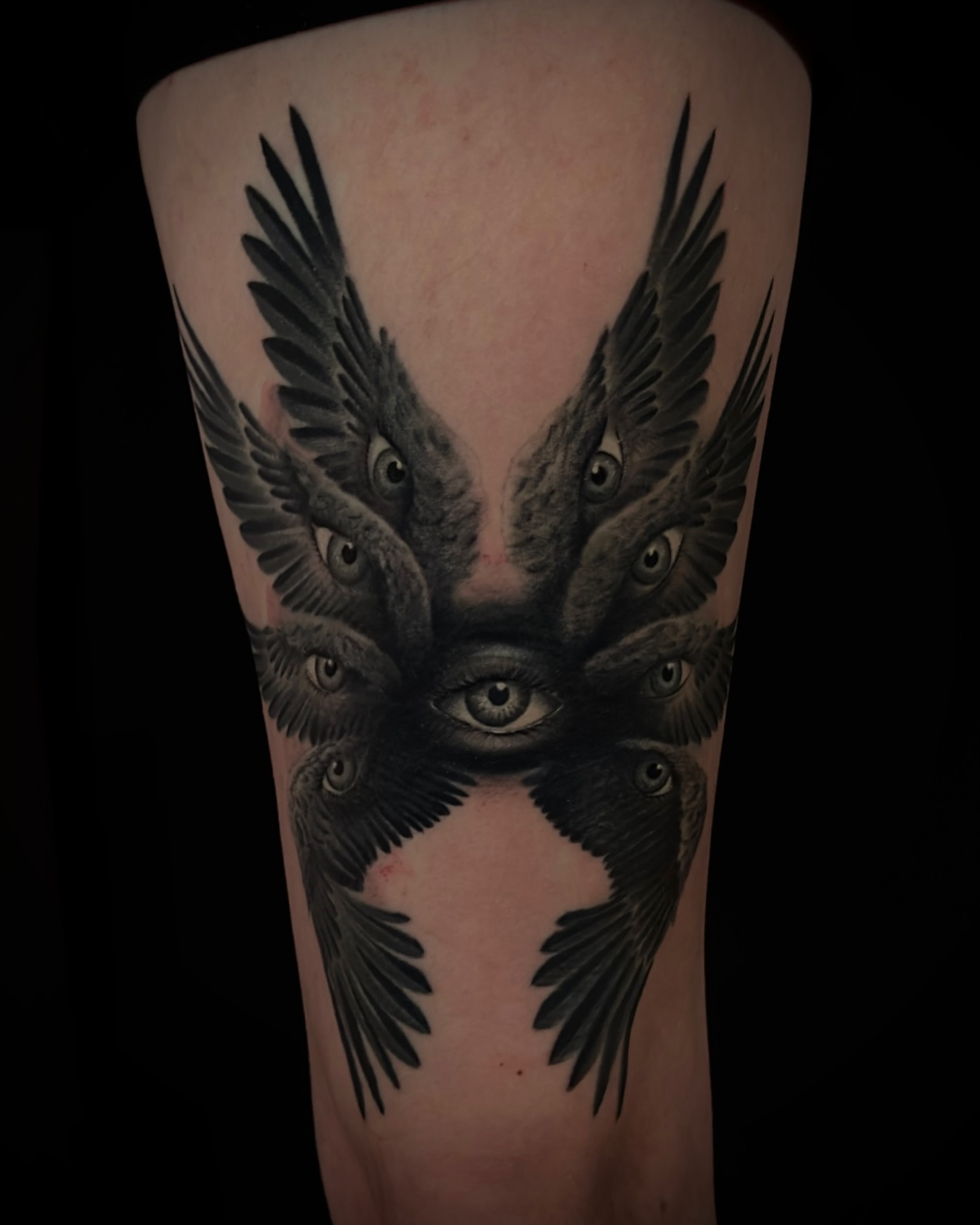 Eyes with birds realism tattoo on the forearm by Nic Luna
