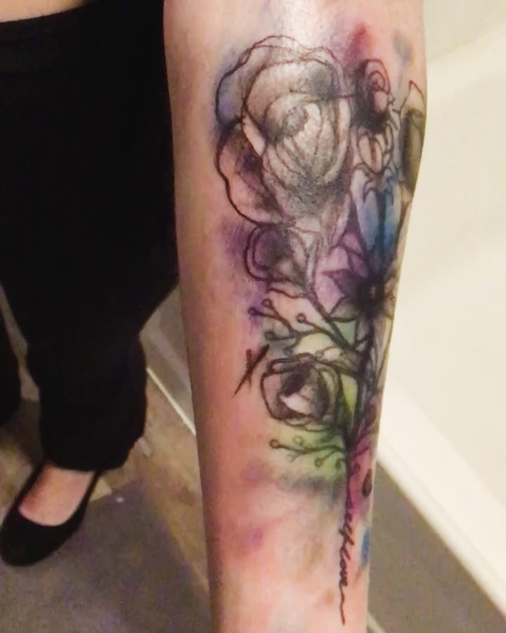 Watercolor floral design watercolor tattoo on the forearm by Gabriel Lawton