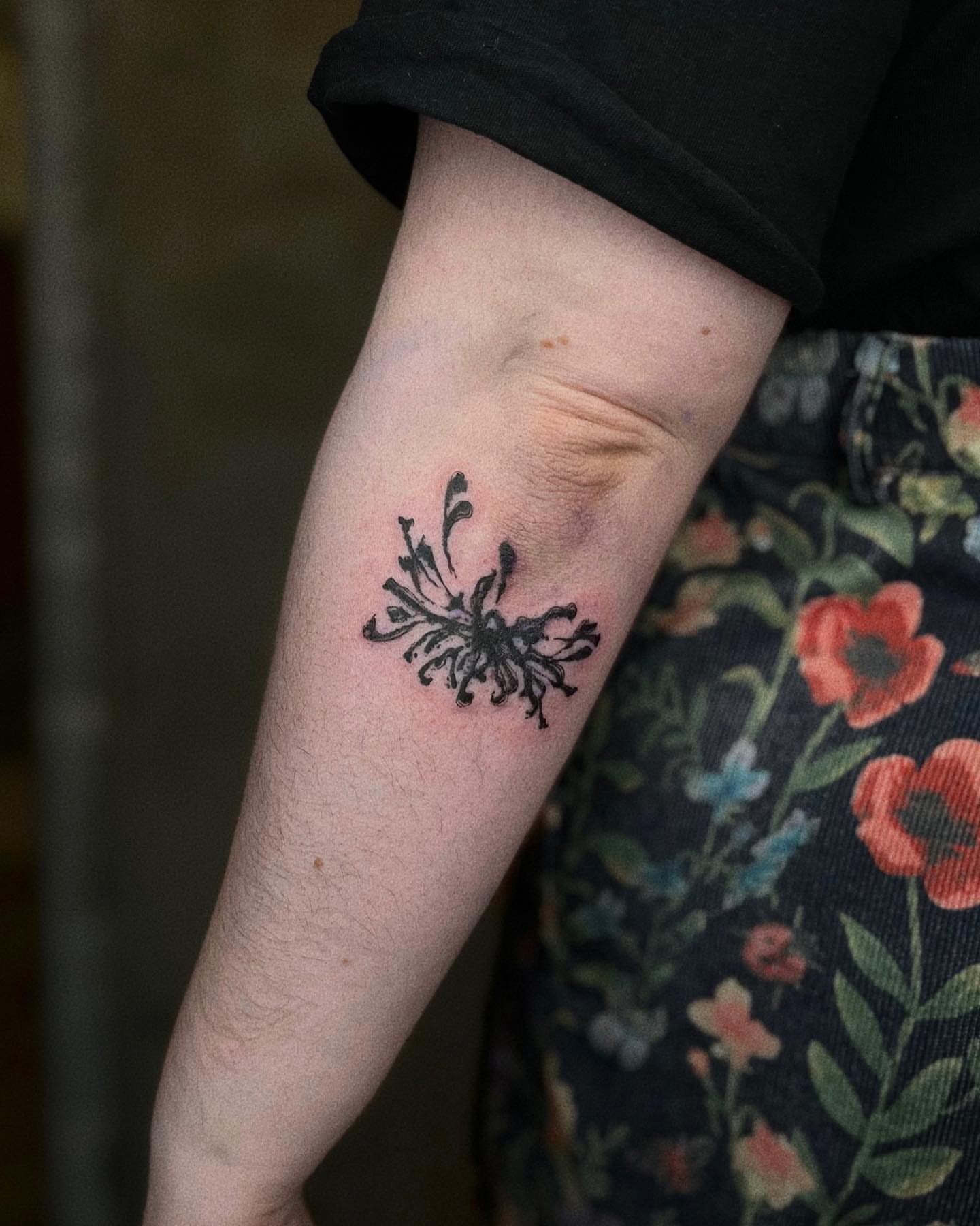 Floral black and grey tattoo on the forearm by San Kang