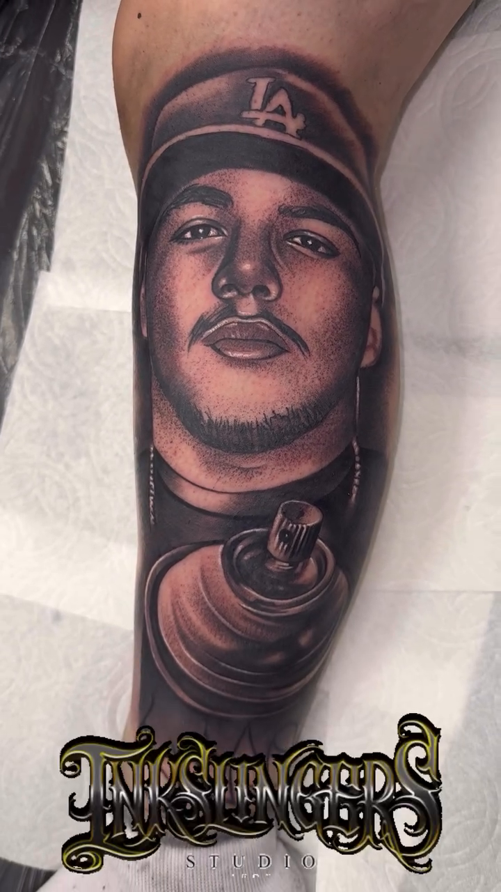 Man and spray can realism tattoo by Tattoo