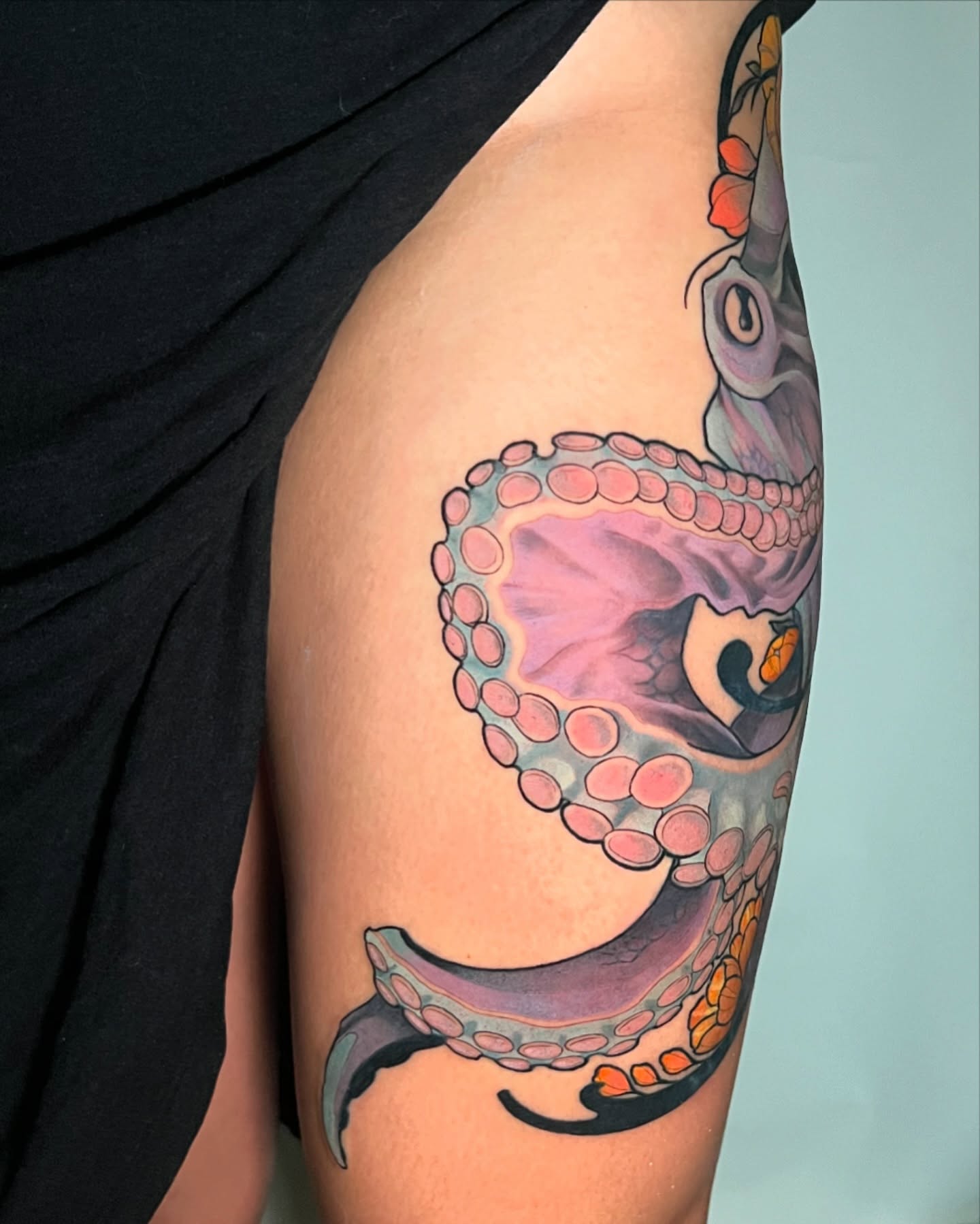 Octopus realism tattoo on the upper arm by Joshua Weeks