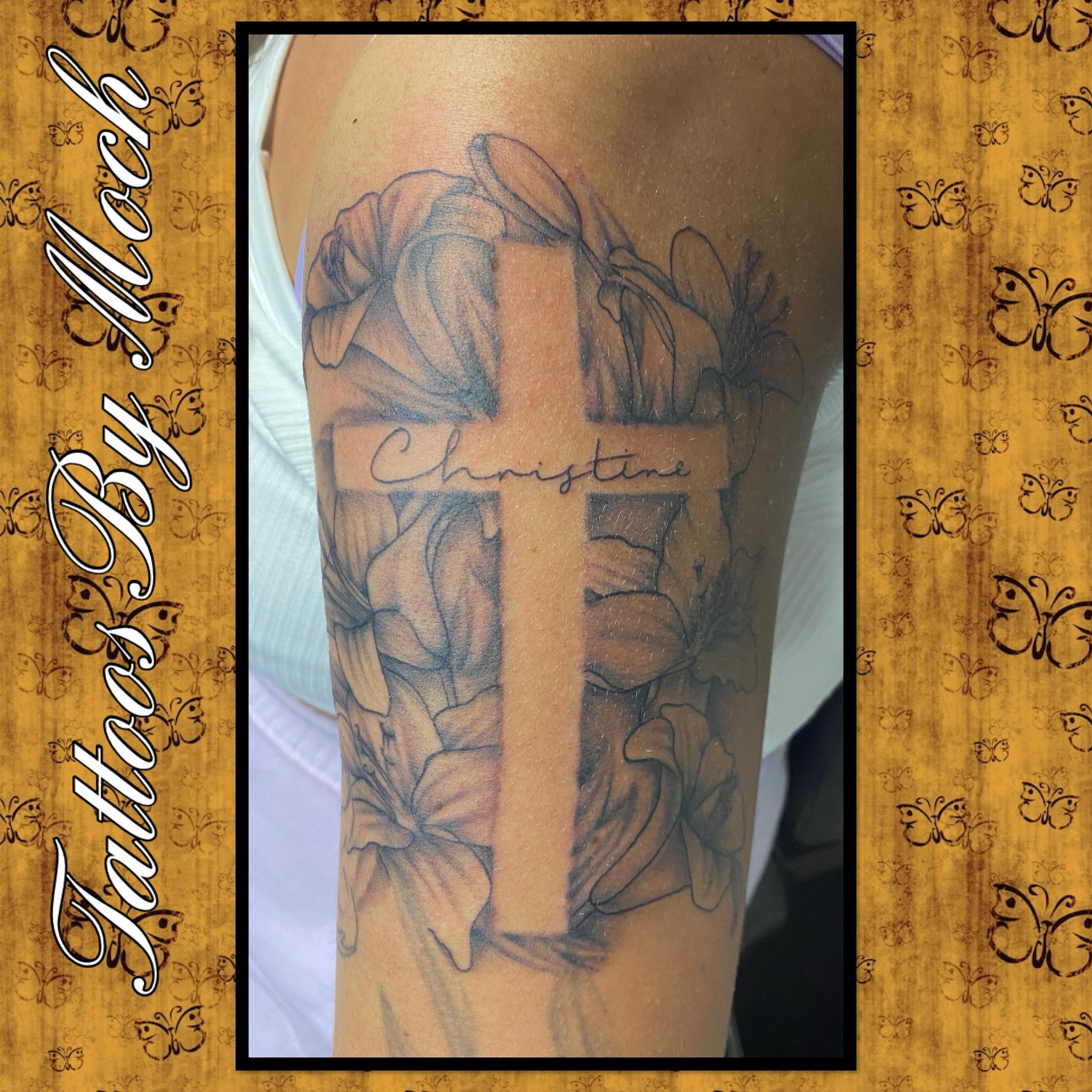 Cross with flowers black and grey tattoo on the forearm by Tattoos By Moch, Toledo, Ohio