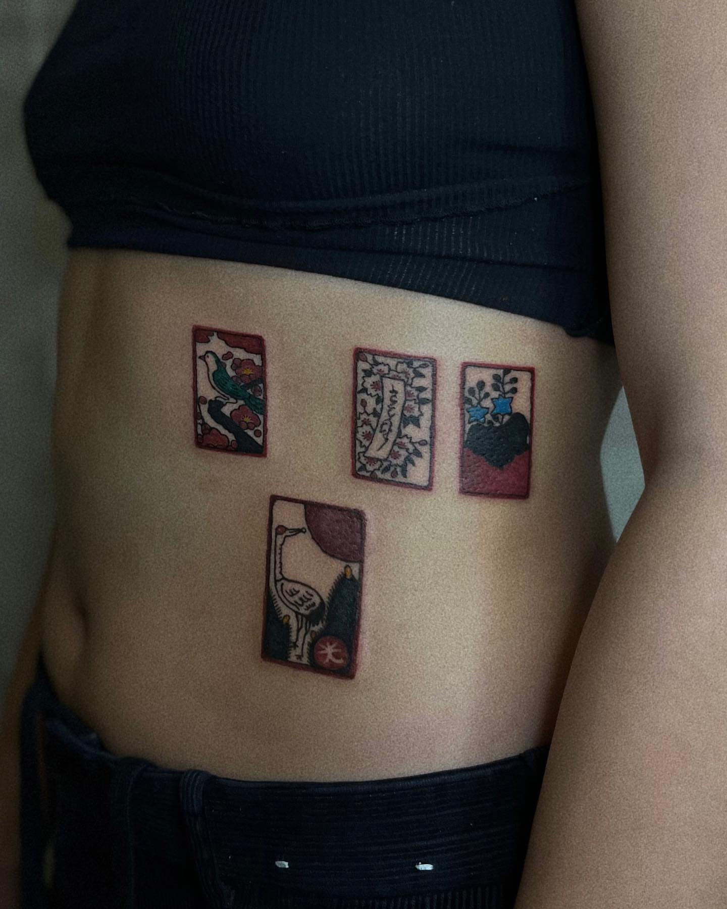 Tarot card motifs neo-traditional tattoo on the torso by San Kang