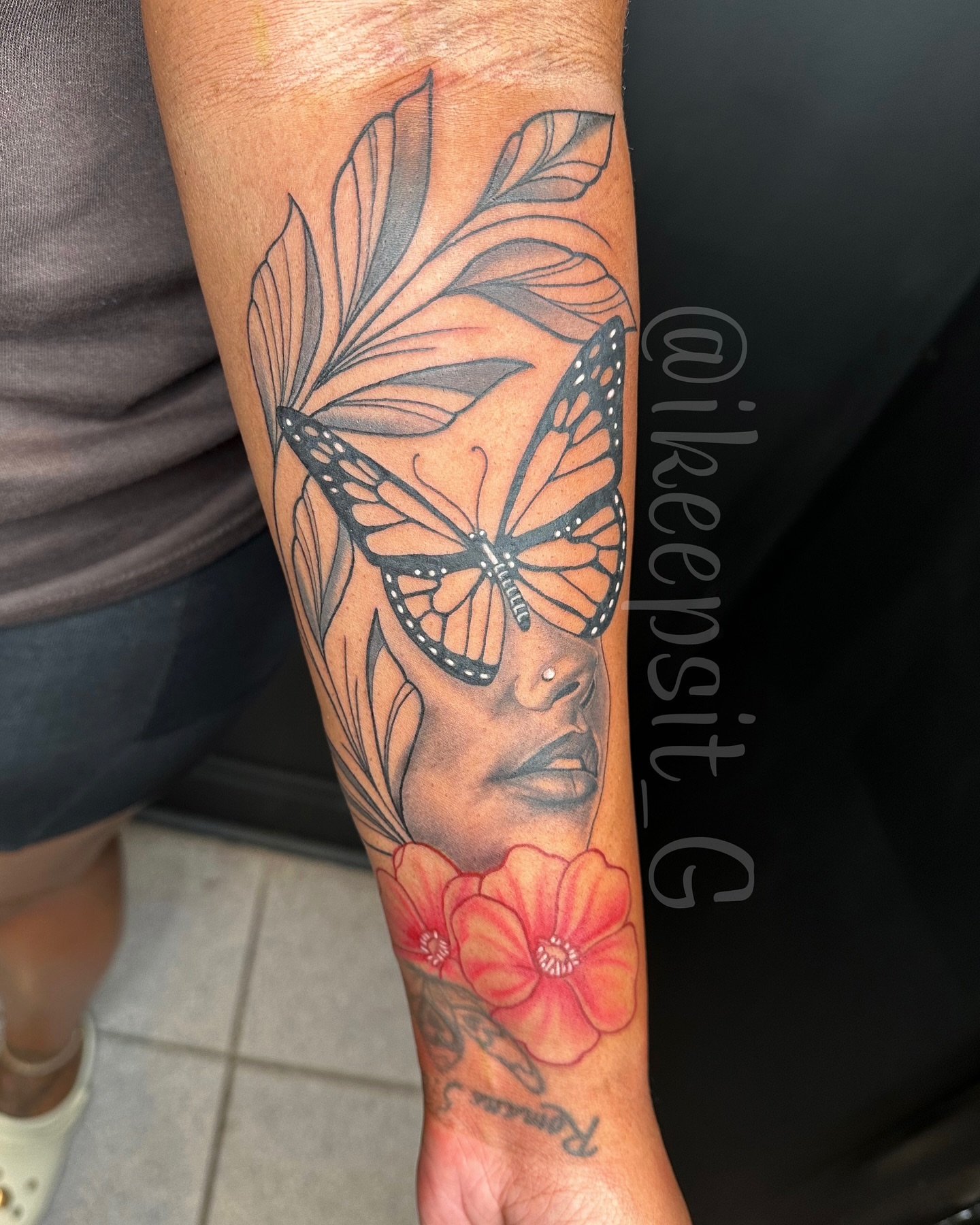 Woman with butterfly and flowers realism tattoo on the forearm by Prolific🏁so Gifted