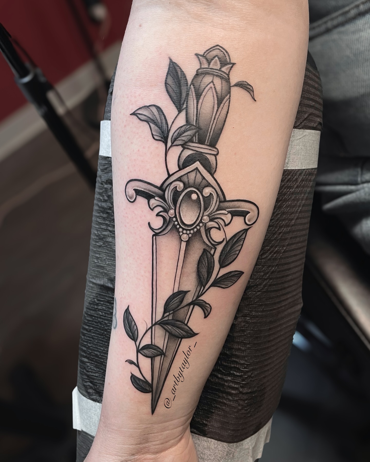 Sword and rose ornamental tattoo on the forearm by Taylor✍🏽️